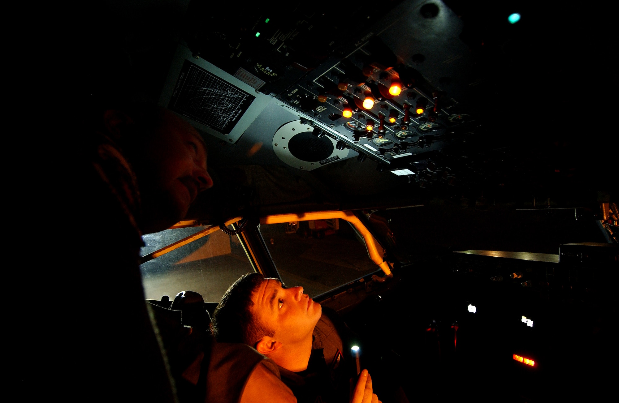 Master Sgt. Steve Hines (left) and Airman David Ballmer, 909th Air Refueling Squadron boom operators, prepare a KC-135 Stratotanker before receiving passengers here Wednesday. The 909th ARS is participating in exercise Northern Edge in Alaska along with other units from Kadena.
(U.S. Air Force photo/Tech. Sgt. Rey Ramon)