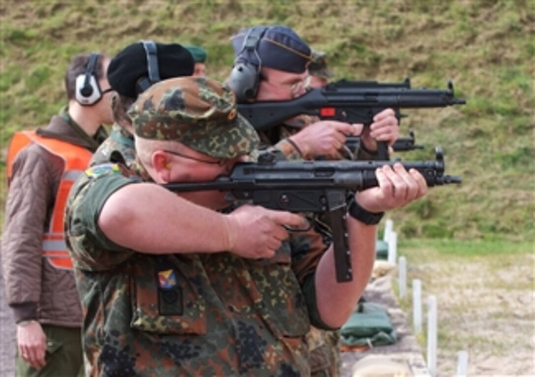 Soldiers from the United States and other countries fire the S-8 automatic weapon at the International Monte Kali Shooting Competition at The U.S. Army Small Arms Range in Messel, Germany, April 25, 2008. 