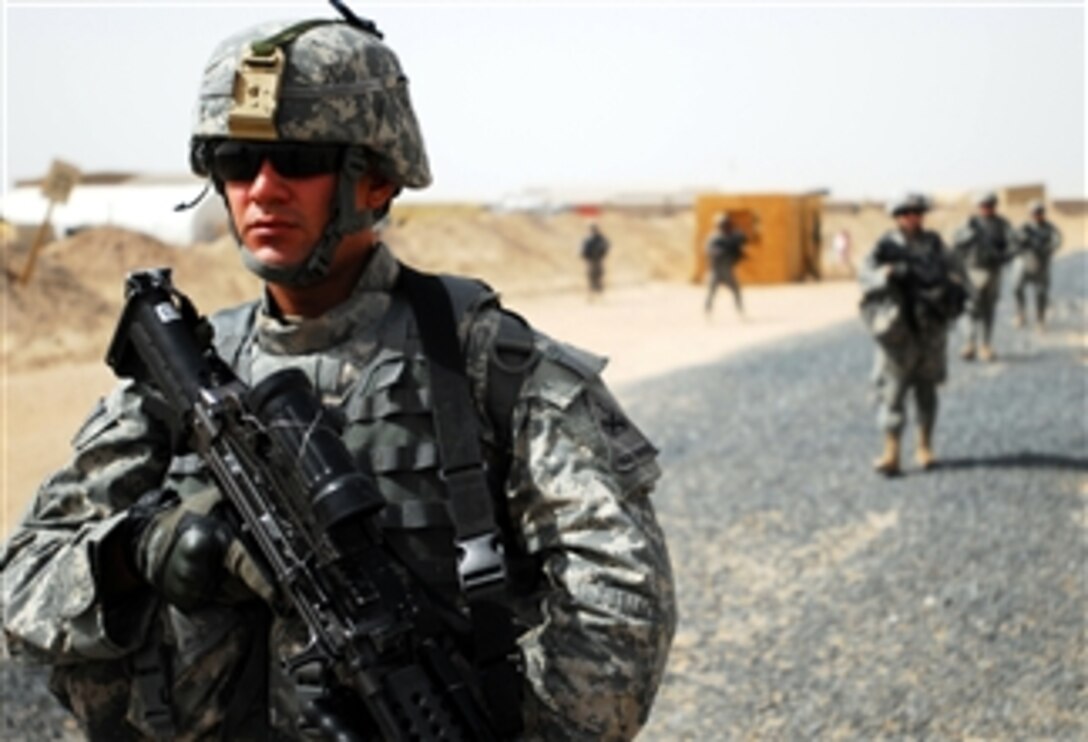 U.S. Army Pfc. Robert Camocho scans a simulated improvised explosive device lane while training at Camp Buehring, Kuwait, April 30, 2008. Camocho is assigned to the 6th Infantry Regiment's Company B, 2nd Battalion. 