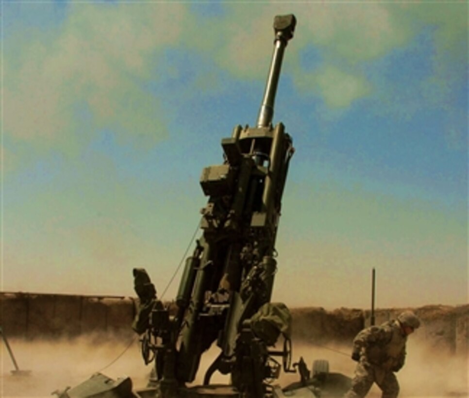 An Excalibur projectile explodes out of an M777 howitzer on Camp Taji, northwest of Baghdad, April 26, 2008. The Excalibur was the first round of this type fired by soldiers from the 25th Infantry Division's 2nd Stryker Brigade Combat Team, 11th Field Artillery Regiment, in support of Operation Iraqi Freedom.