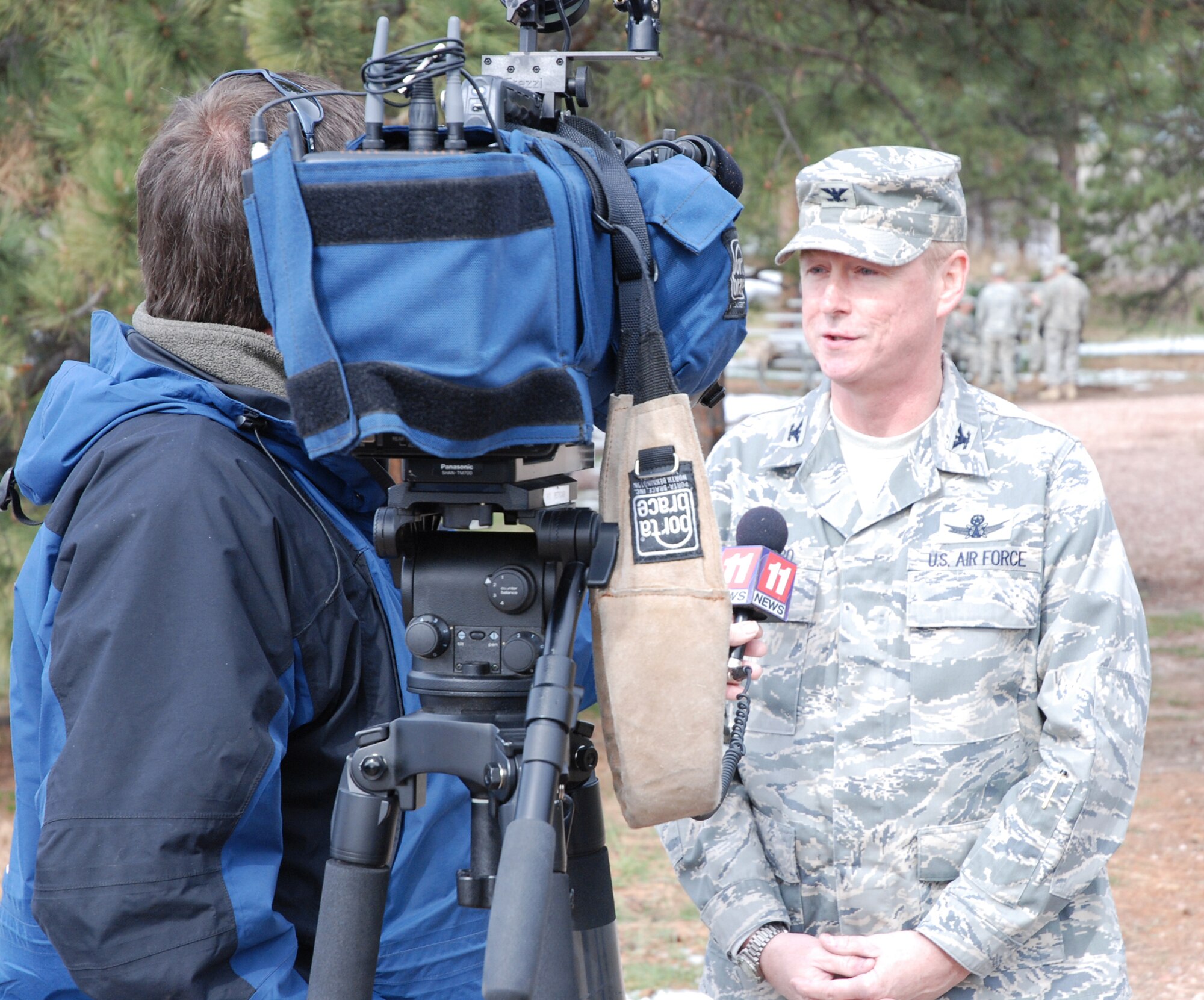 Col. Scott Shepherd, 21st Space Wing vice commander, talks with local media about the 21st Space Wing’s involvement with Guardian Challenge 2008 May 2 at the U.S. Air Force Academy, Colo. Colonel Sheppard was joined by other 21st SW leadership to cheer on the joint 21st/721st Security Forces Squadron team before their Guardian Challenge urban warfare competition. The six-man team is comprised of Tech. Sgt. Cesar Ochoa, Staff Sgts. Jordan Freeman, Brian Marshall and Jeffrey Turner, Senior Airman Eric Frias and Airman Stacy John. (U.S. Air Force photo/Senior Airman Stephen Collier)
