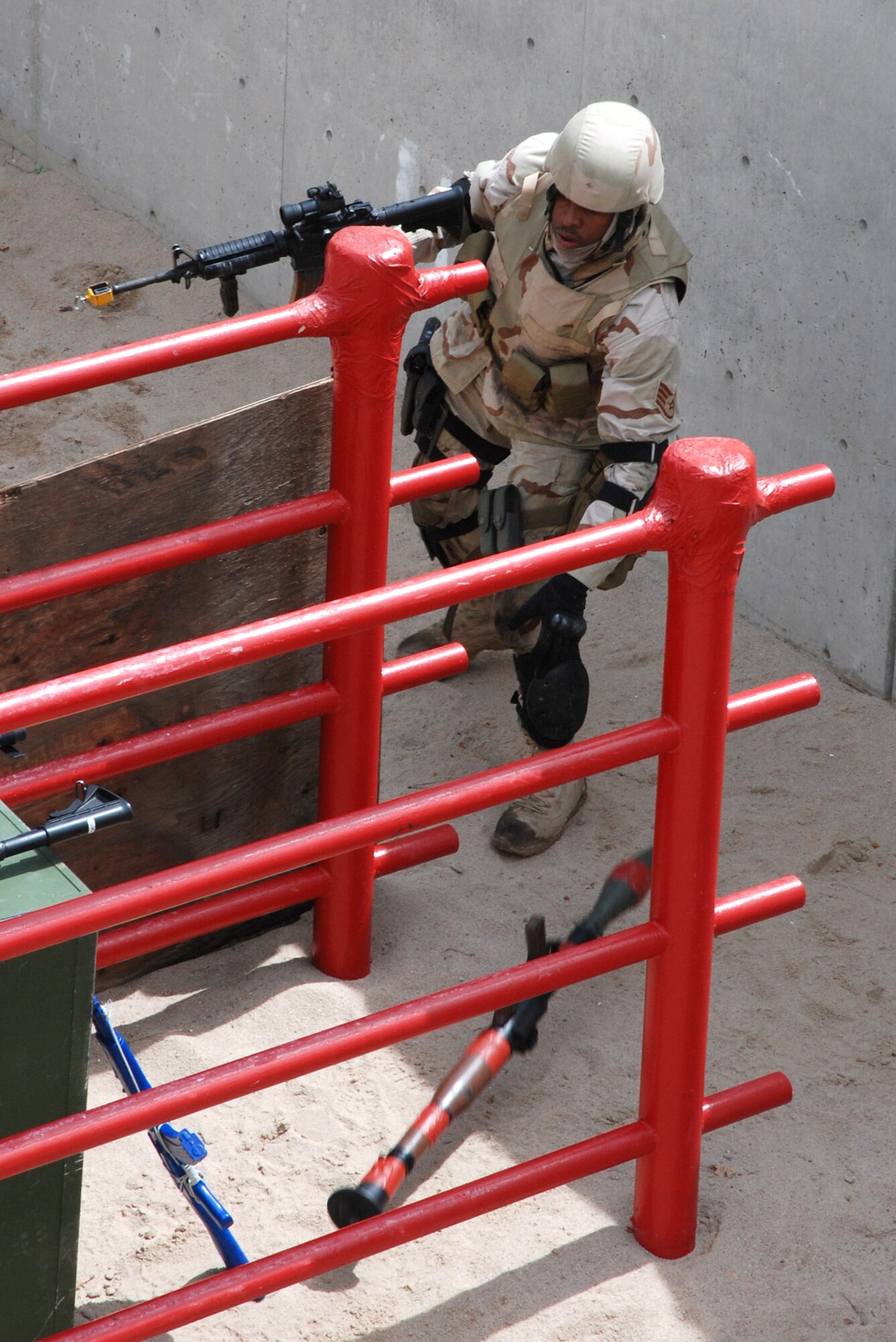 Staff Sgt. Jordan Freeman tosses aside a fake rocket-propelled grenade from the hands of a simulated enemy combatant May 2 at the U.S. Air Force Academy, Colo. Sergeant Freeman is a member of the joint 21st/721st Security Forces Squadron Guardian Challenge team. The team competed against others throughout Air Force Space Command to determine which is the “best of the best” in defending installations and space assets world-wide. The six-man team is comprised of Tech. Sgt. Cesar Ochoa, Staff Sgts. Jordan Freeman, Brian Marshall and Jeffrey Turner, Senior Airman Eric Frias and Airman Stacy John. (U.S. Air Force photo/Senior Airman Stephen Collier)