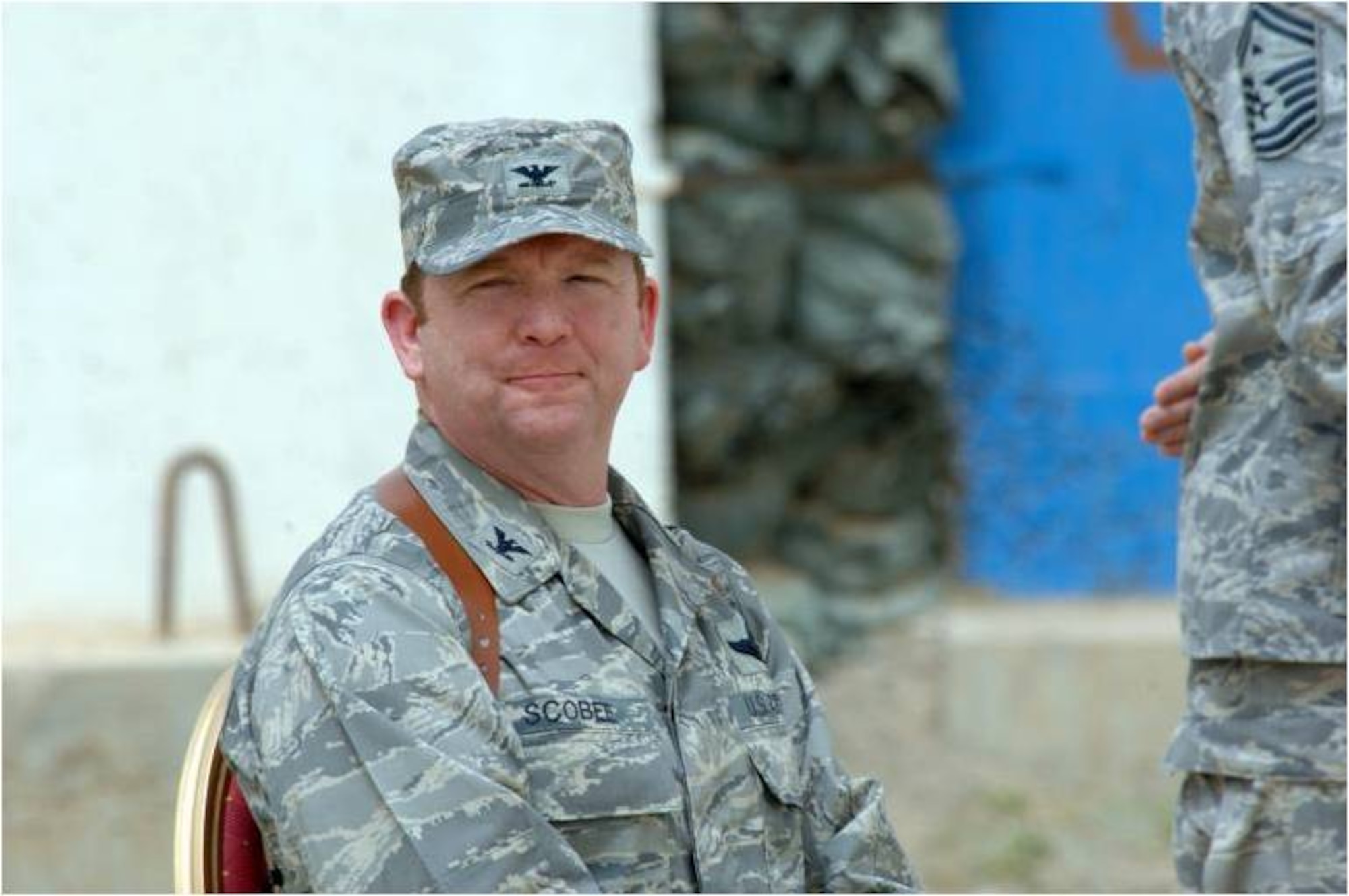 KIRKUK REGIONAL AIR BASE, Iraq -- Col. Richard Scobee accepts command of the 506th Air Expeditionary Group from Brig. Gen. Burton Field, 332nd Air Expeditionary Wing commander, April 30, here. Colonel Scobee is the 944th Fighter Wing commander, Luke Air Force Base, Ariz. (U.S. Air Force photo/Senior Airman SerMae Lampkin)