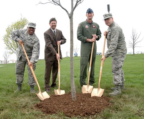 (From left to right) 55th Wing Command Chief Master Sgt. Kenneth Funderburg, Deputy Base Civil Engineer Mark Jacobsen, 55th Wing Commander Brig. Gen. James Jones and 55th Mission Support Group Commander Col. Michael Stinson participate in the annual Arbor Day Tree Planting April 25th here. Offutt has been named Tree City USA for the last 20 years by the Arbor Day Foundation. (U.S. Air Force Photo By/Jeff Gates) 