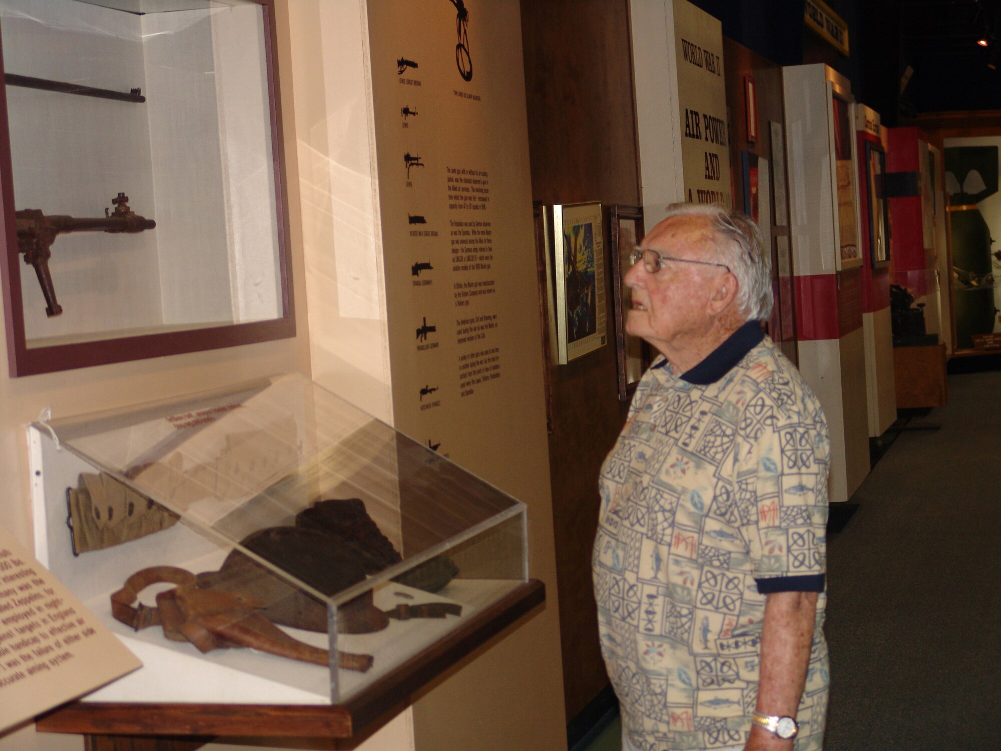 EGLIN AIR FORCE BASE, Fla. -- Larry Jackson looks at a display at the Air Force Armament Museum.  Mr. Jackson, a World War II veteran, was a visitor the first day the museum reopened, May 2.