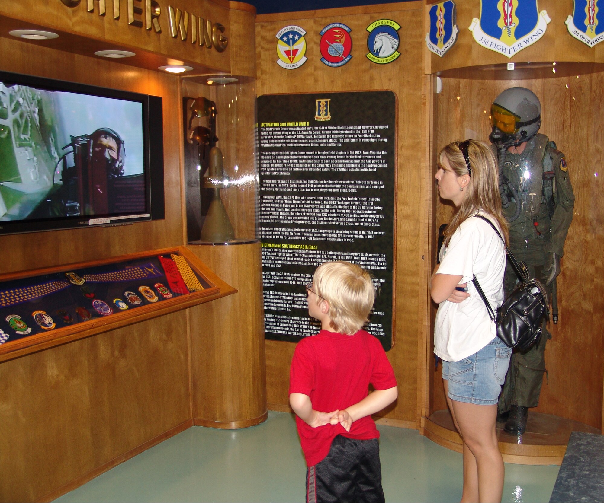 EGLIN AIR FORCE BASE, Fla. -- Valerie Gardner and her son, Justin, look at displays at the Air Force Armament Museum. The museum reopened to the general public May 2. (USAF photo by Lois Walsh)