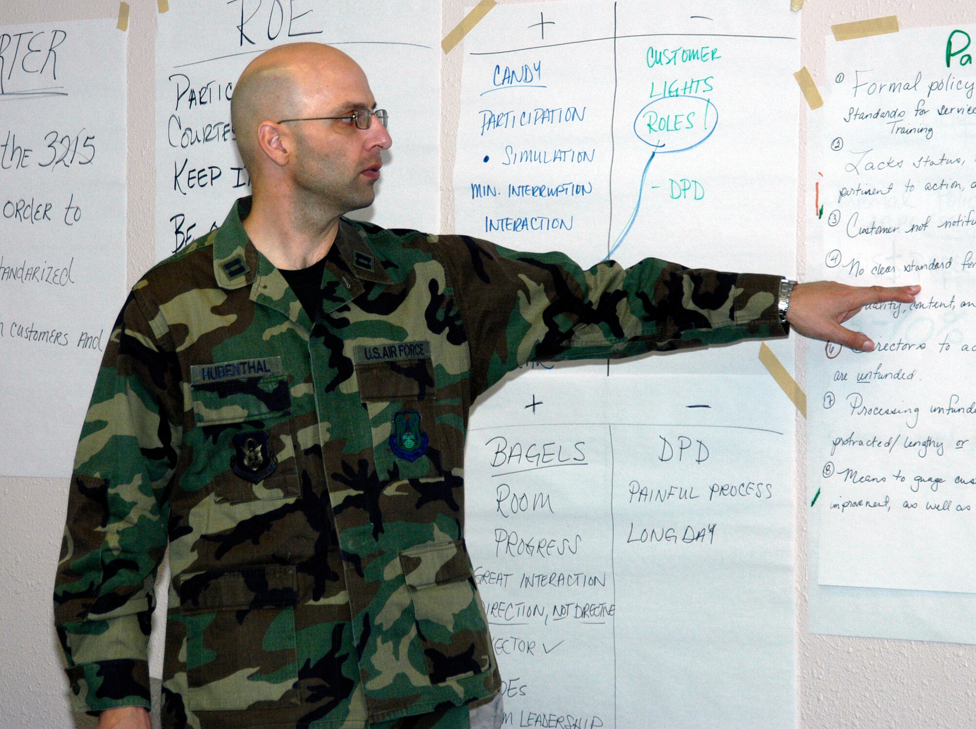 Capt. Paul Hubenthal, AFSO 21 office, facilitates the rapid improvement event to examine the way requests for computer software, equipment and other services are processed at the Air Reserve Personnel Center. The event yielded plans to create an online request process that will replace the hard-copy version of the Air Force Form 3215 at ARPC. (U.S. Air Force photo/Mike Molina)