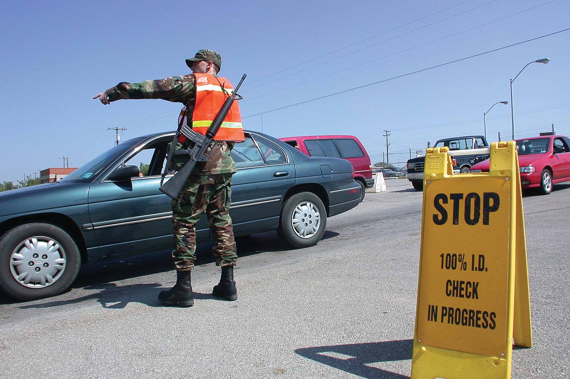 In the days after Sept. 11, 2001, lines of traffic inched toward base gates as security procedures changed in moments, many of those changes becoming permanent. Base protection from terrorism is now a constant, evolving way of life requiring, to some degree, everyone’s involvement and alertness.  (Air Force photo by Margo Wright)
