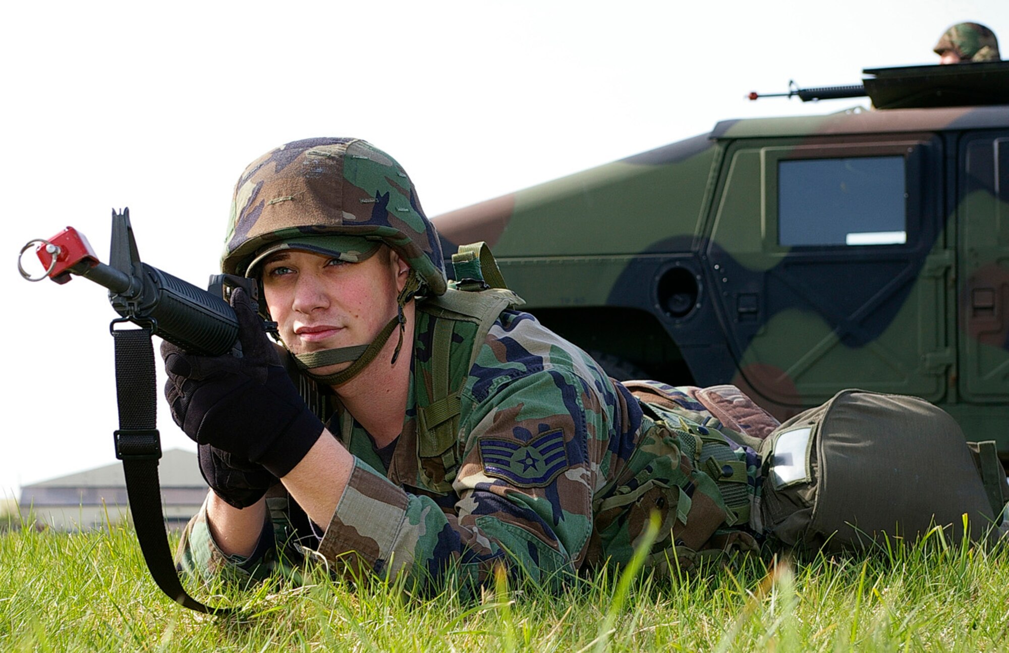 Staff Sgt. Justin Hacker, 100th CES Programs Flight, keeps a lookout for "enemies" during a short-halt convoy operation April 25. Eleven troops from RAF Lakenheath and 47 from RAF Mildenhall participated in the training over a two-day period at RAF Mildenhall. (U.S. Air Force photo by Karen Abeyasekere)