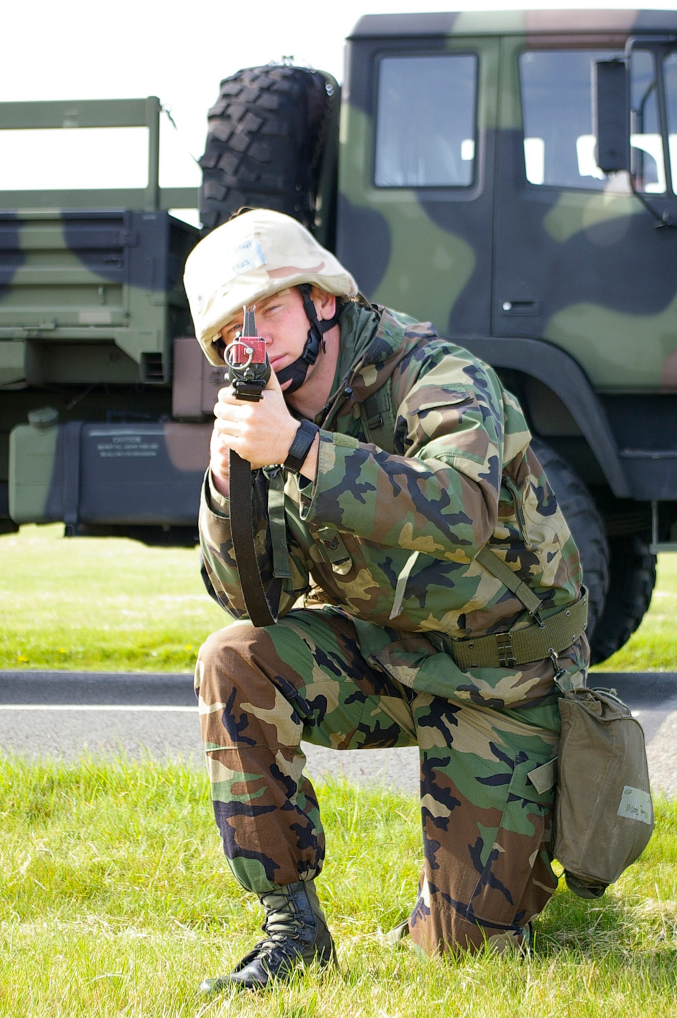 Staff Sgt. Michael Peters, 48th CES Power Production, keeps a lookout for "enemies" during a short-halt convoy operation April 25. Eleven troops from RAF Lakenheath and 47 from RAF Mildenhall participated in the training over a two-day period at RAF Mildenhall. (U.S. Air Force photo by Karen Abeyasekere)