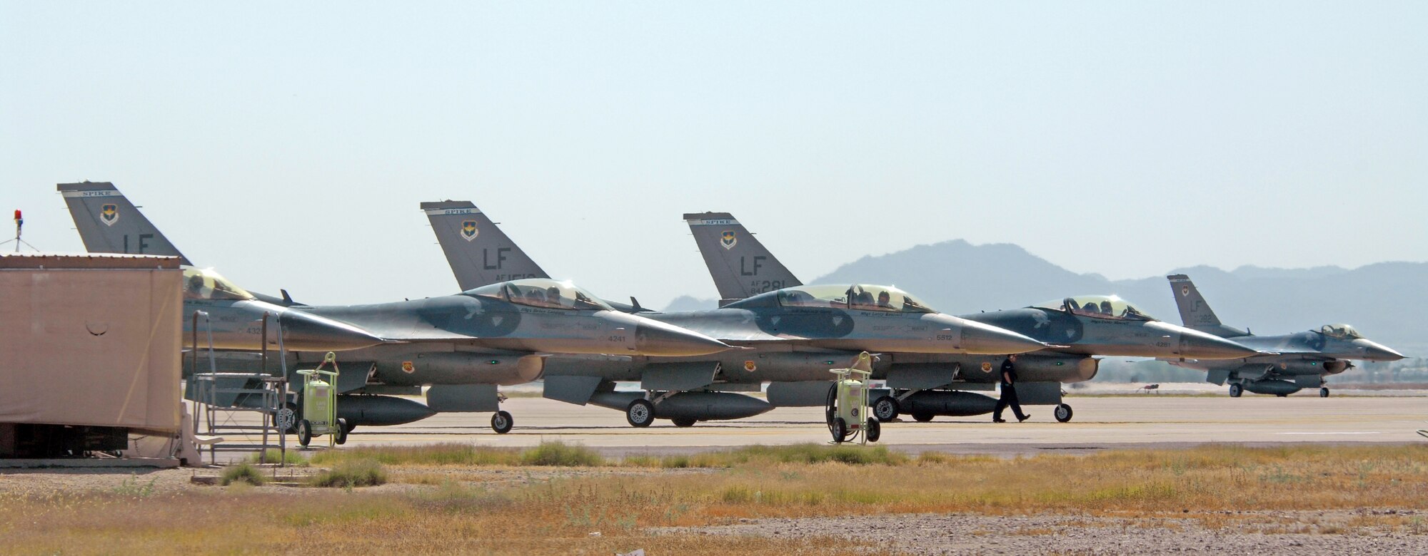 F-16's from the 62nd Fighter Squadron await take-off orders at the north end of runway on April 29. at Luke Air Force Base, Ariz.
U.S. Air Force photo by Tech. Sgt. Raheem Moore