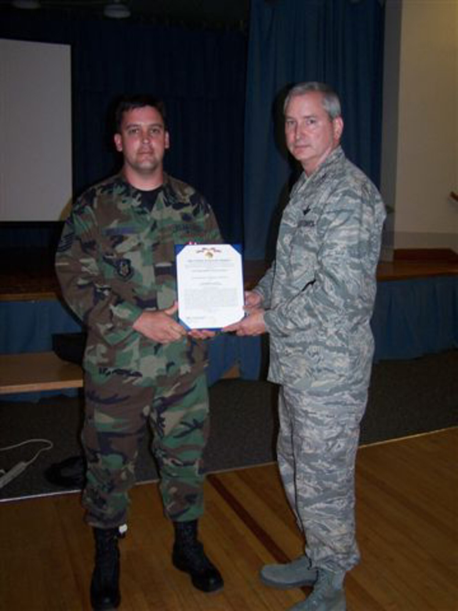 SEYMOUR JOHNSON AIR FORCE BASE, N.C. -- Col. Fritz Linsenmeyer (right) presents the Air Force Meritorious Service Medal to Master Sgt. Jammison Applequist for outstanding work as a fuels manager. Col. Linsenmeyer is the 916th Air Refueling Wing commander and Sgt. Applequist is a Reservist with the 916th Logistics Readiness Squadron.