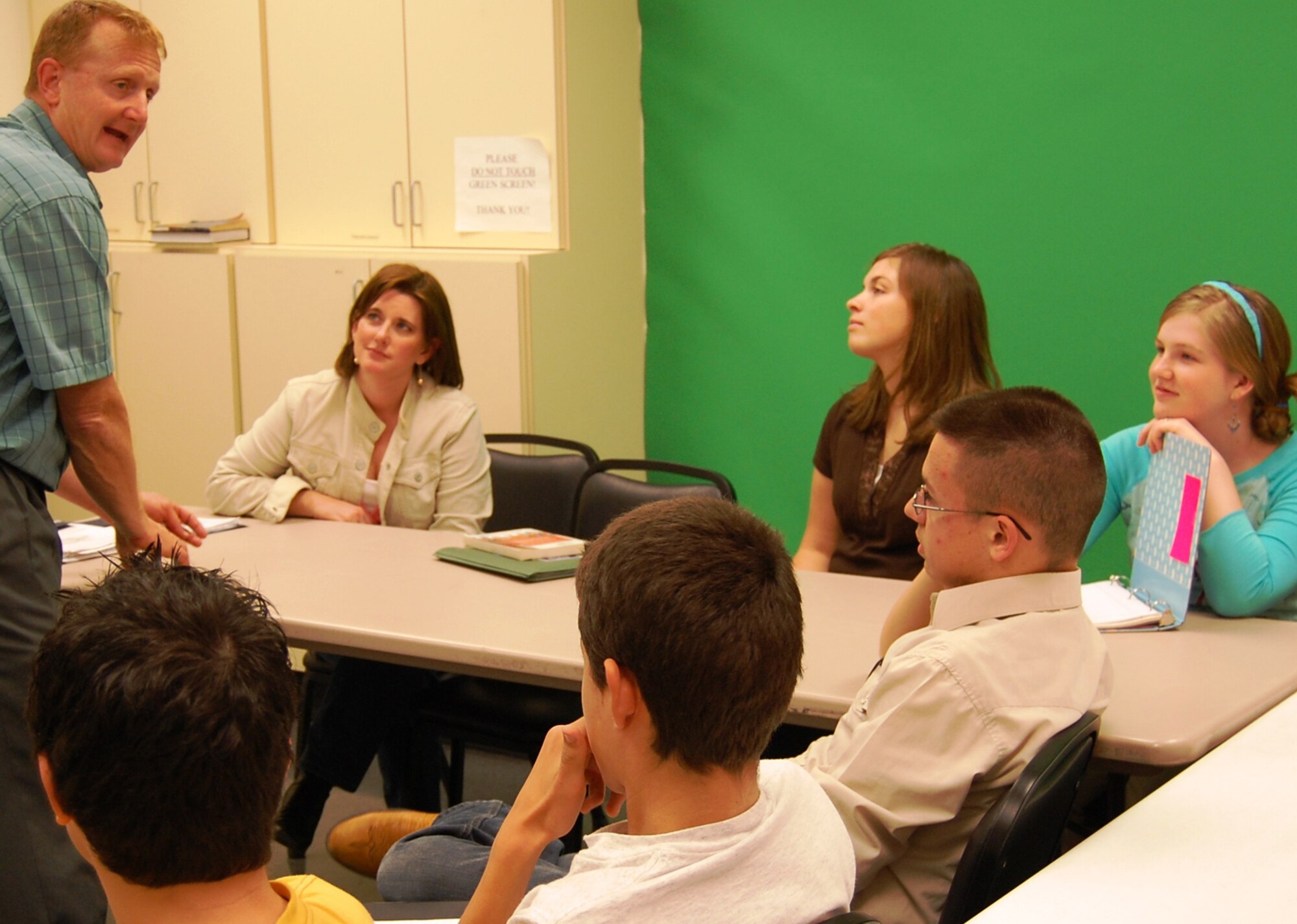 Colonel Roshetko explains the events leading up to the June 6, 1944, D-Day invasion of Europe to students and a parent.  (U.S. Air Force photo by Steve Pivnick)