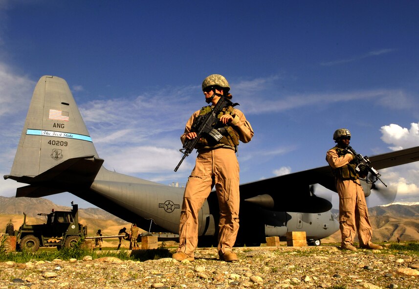 Airman 1st Class Kelliea Guthrie (left) and Senior Airman Greg Ellis provide security April 23 for a C-130 Hercules aircraft during a cargo mission at Feyzabab Airfield in Afghanistan. Both Airmen are part of the fly-away security forces team assigned to the 455th Expeditionary Security Forces. (U.S. Air Force photo by Master Sgt. Andy Dunaway) 