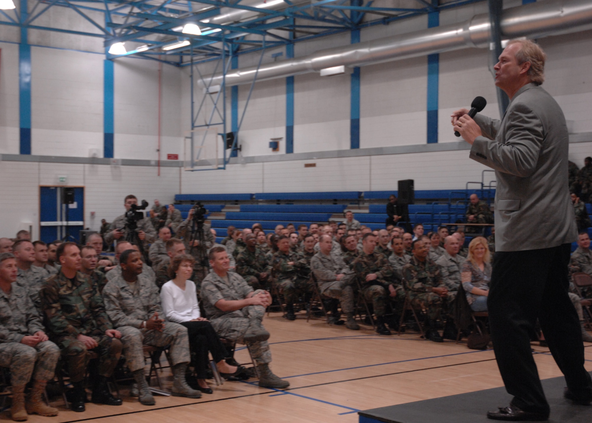 Dan Clark addresses Liberty Airmen April 24 at the Lakenheath Fitness Center at RAF Lakenheath, England. Mr. Clark told several motivational stories and encouraged Airmen to demand excellence of themselves. (U.S. Air Force photo by Airman 1st Class John Easterling)