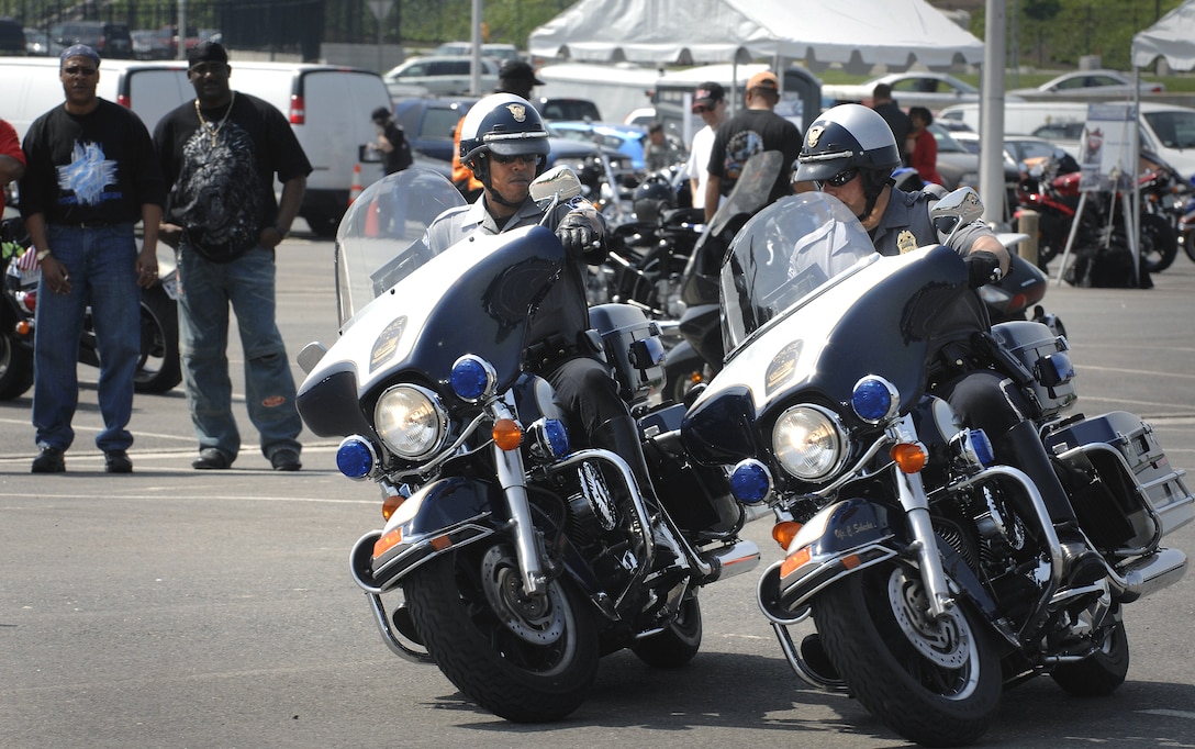 Pentagon motorcycle police officers Terry Collins, left, and Chris Sobecke, demonstrate a “partner ride” during the second annual National Capital Region Joint Services motorcycle safety event held at the Pentagon, May 2, 2008.