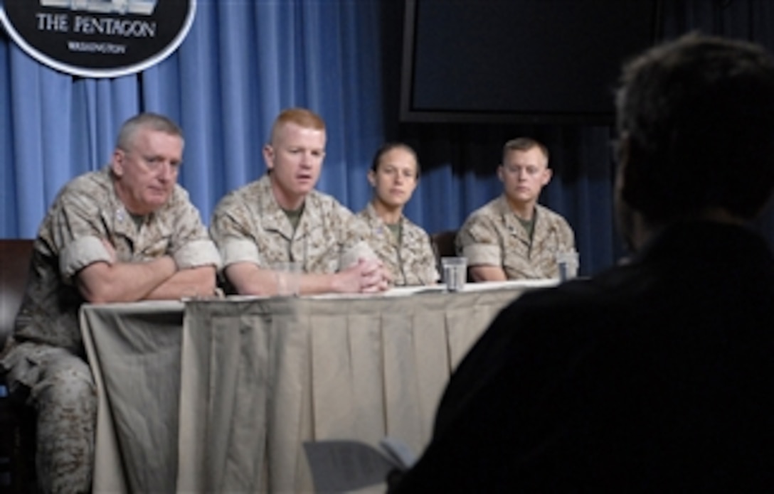U.S. Marine Lt. Col. Paul Rock (2nd from left) answers a reporter's question about the initial combat deployment of the MV-22 Osprey during a Pentagon press briefing in Arlington, Va., on May 2, 2008.  Rock, Deputy Commandant for Marine Corps Aviation, Lt. Gen. George J. Trautman III (left), Capt. Sara Faibisoff (2nd from right) and Marine Sgt. Danny Herrman, discussed experiences as the first unit to take the MV-22 Osprey into combat.  Rock, Faibisoff and Herrman are attached to Marine Medium Tiltrotor Squadron 263.  