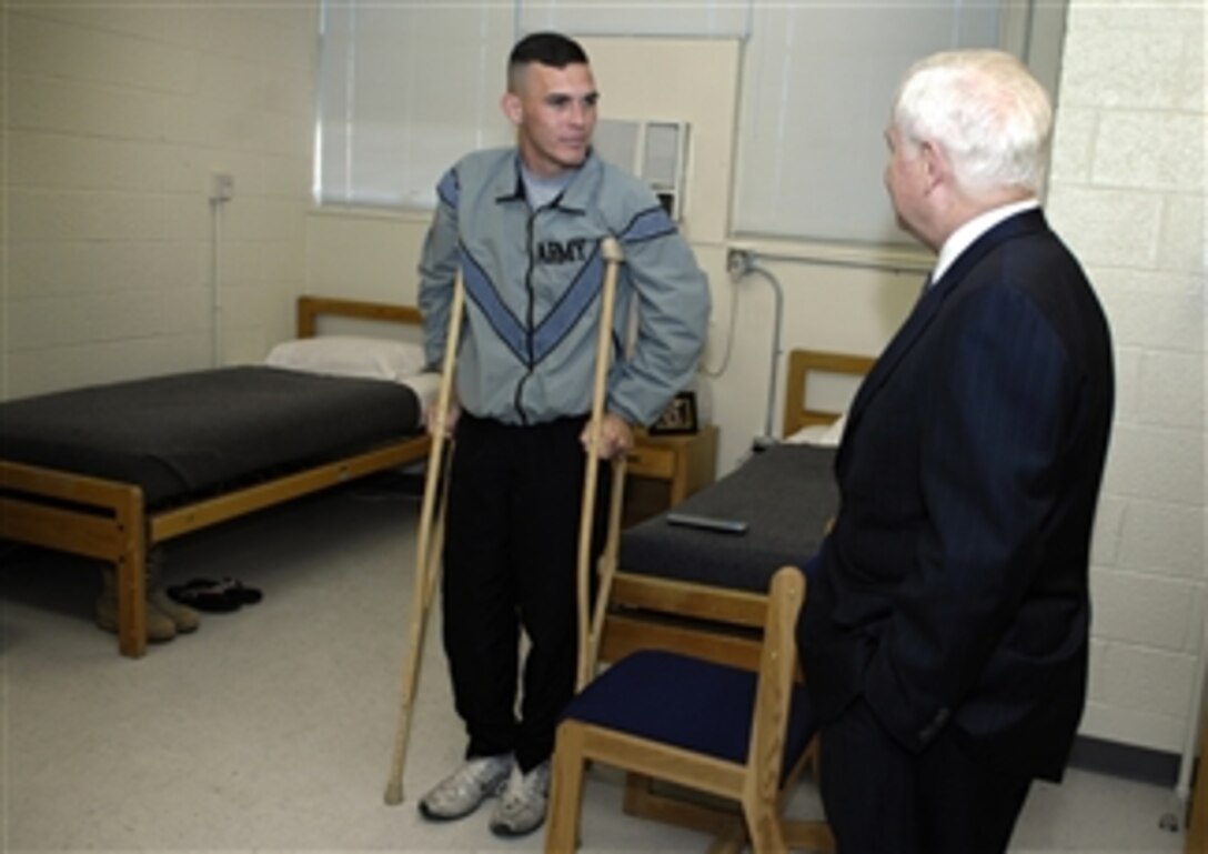 Defense Secretary Robert M. Gates meets with a soldier as he tours the warrior transition unit at the William Beaumont Army Medical Center on Fort Bliss in El Paso, Texas, May 1, 2008.   