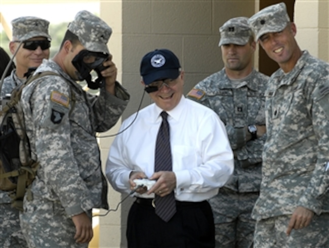 Defense Secretary Robert M. Gates learns how to operate an unmanned ground vehicle, or UGV, during a tour of the future combat systems facility on Fort Bliss in El Paso, Texas, May 1, 2008.   