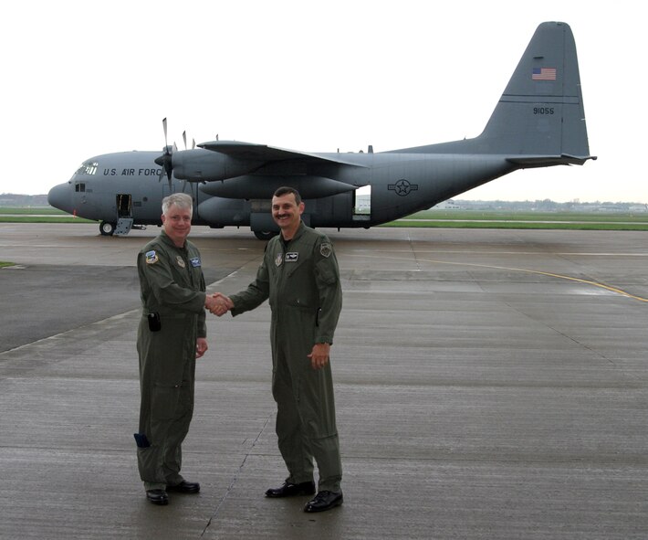 NIAGARA FALLS AIR RESERVE STATION, N.Y. - Col. Patrick Ginavan, 107th Airlift Wing commander, New York Air National Guard (left) and Col. Reinhard Schmidt, 914th Airlift Wing commander, Air Force Reserve, cement the partnership for the first ever Guard and Reserve C-130 association.  The association will allow both units to preserve and share their extensive flight experience and be combat ready in support of U.S. interests at home and abroad.  (U.S. Air Force photo / Tech. Sgt. Christopher Boswell)