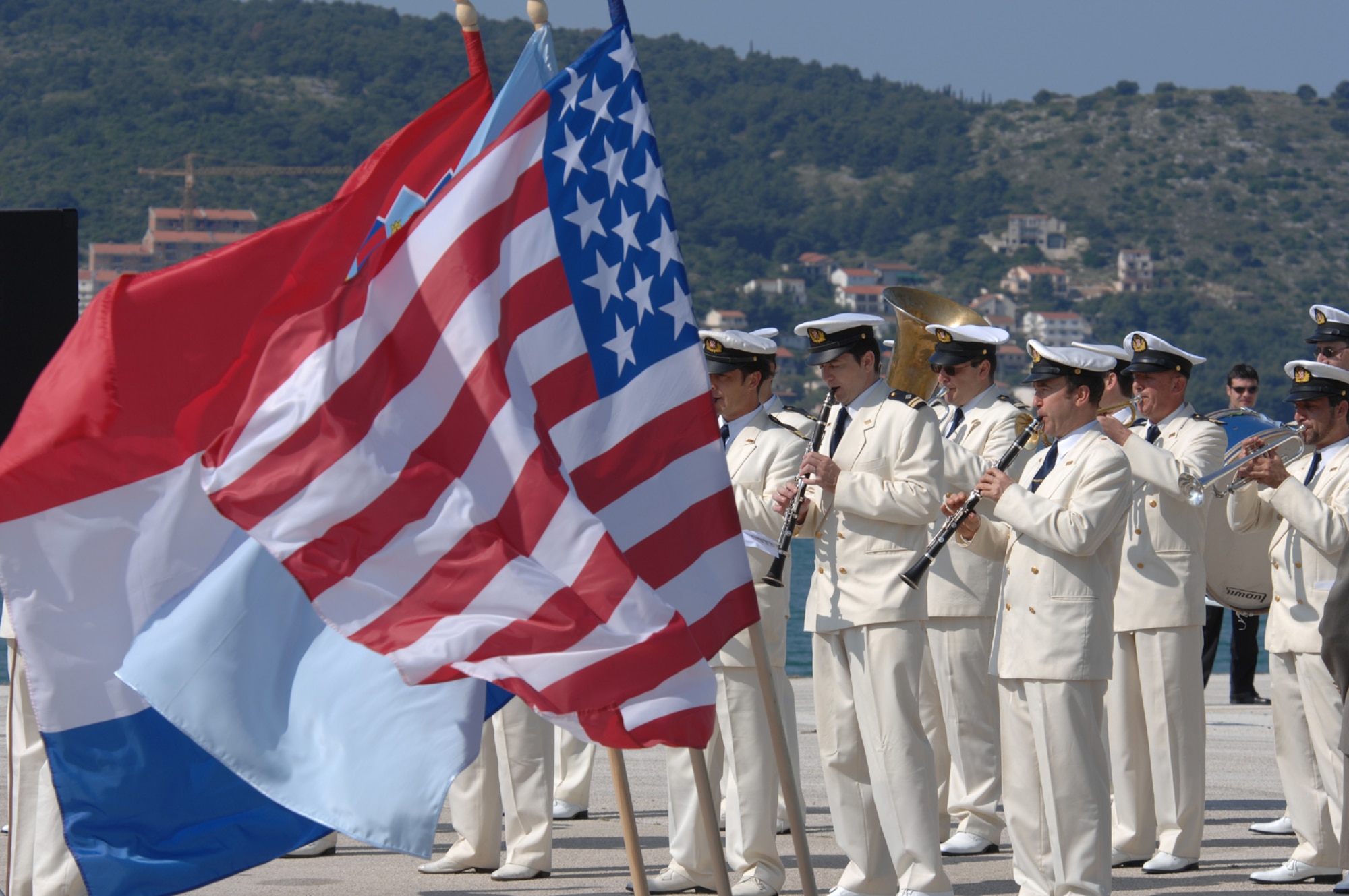 DIVULJE TRAINING BASE, Croatia – The Croatian Navy Military Orchestra perform the U.S. and Croatian National anthems to commemorate the opening ceremony of the 2008 Medical Training Exercise in Central and Eastern Europe (MEDCEUR).  Fifteen nations are participating in the exercise from May 2 through 14. The exercise focuses on mass-casualty training scenarios and humanitarian aid in response to crises situations. More than 400 multi-nationals are attending the exercise in support of the Partnership for Peace initiative. (U.S. Air Force photo/Staff Sgt. Kristin Ruleau)