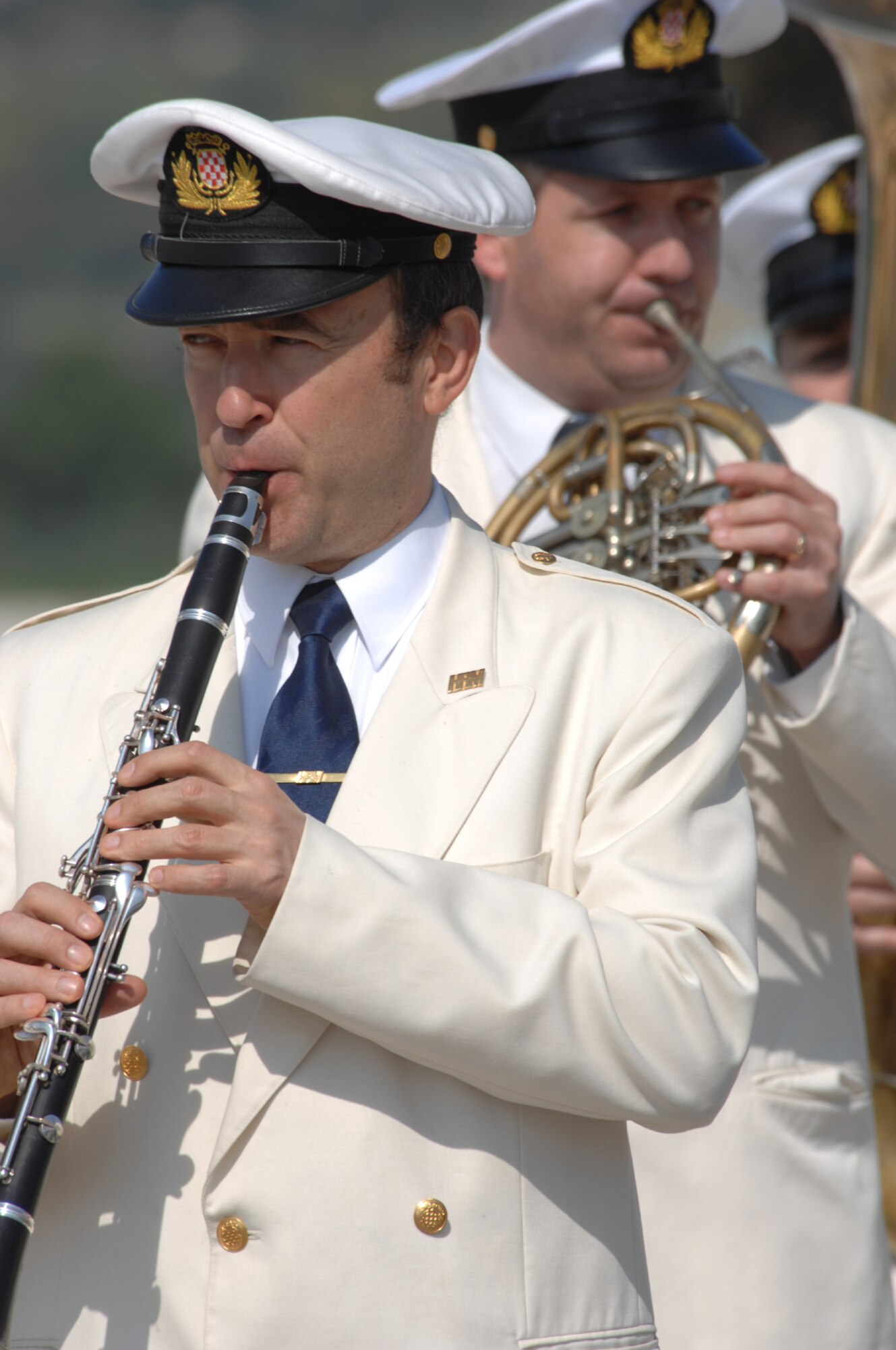 DIVULJE TRAINING BASE, Croatia – The Croatian Navy Military Orchestra perform the U.S. and Croatian National anthems to commemorate the opening ceremony of the 2008 Medical Training Exercise in Central and Eastern Europe (MEDCEUR).  Fifteen nations are participating in the exercise from May 2 through 14. The exercise focuses on mass-casualty training scenarios and humanitarian aid in response to crises situations. More than 400 multi-nationals are attending the exercise in support of the Partnership for Peace initiative. (U.S. Air Force photo/Staff Sgt. Kristin Ruleau)