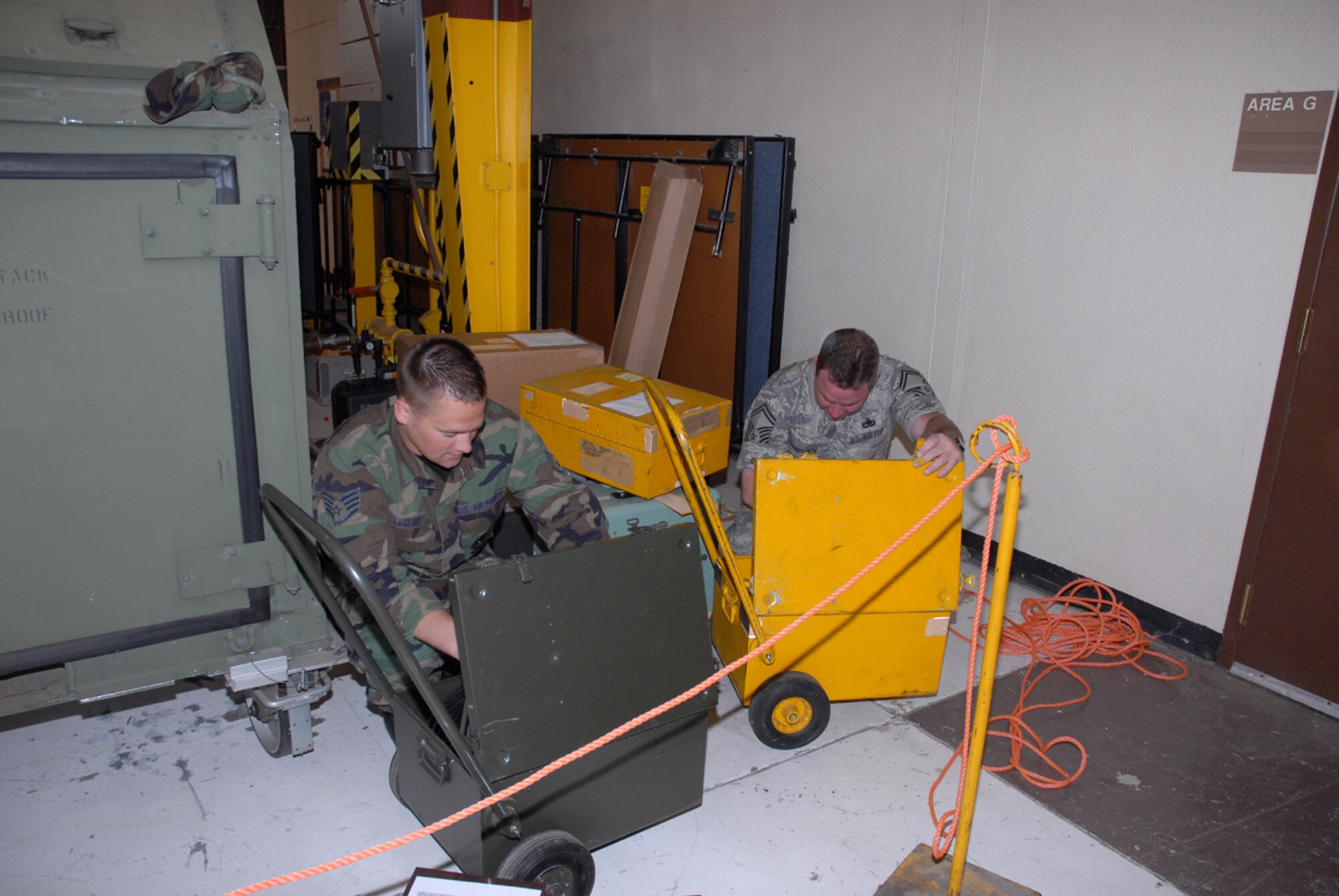 BEALE AIR FORCE BASE, Calif. -- Staff Sgt. Jason LeClair (left) and Senior Master Sgt. Paul Belden take inventory and pack vital maintenance equipment while at Beale Air Force Base. Both are reservists with the 916th Air Refueling Wing and are preparing to accept more KC-135R Stratotankers from Beale this month. Sgt. LeClair is a crew chief and Sgt. Belden is Specialist Flight Chief with the 916th Aircraft Maintenance Squadron. U.S. Air Force photo/Ms. Ellen Hatfield