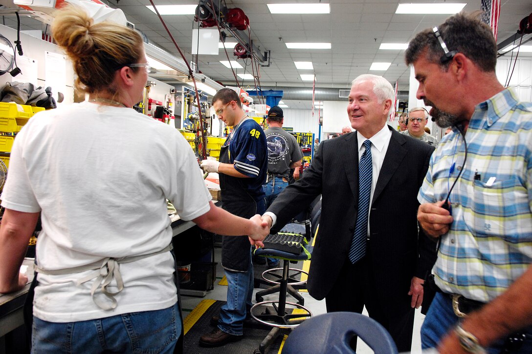 Defense Secretary Robert M. Gates meets with a worker at the Bradley ...