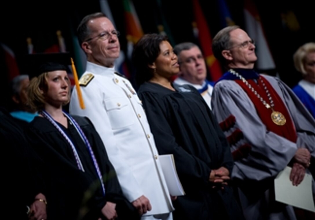 From left: Christine Tillman, the University of Kentucky outstanding senior, Navy Adm. Mike Mullen, chairman of the Joint Chiefs of Staff, commencement speaker Beverly Kirk and University of Kentucky President Lee T. Todd Jr. sing "My Old Kentucky Home" at the conclusion of the university's commencement exercises in Lexington, Ky., May 4, 2008. 