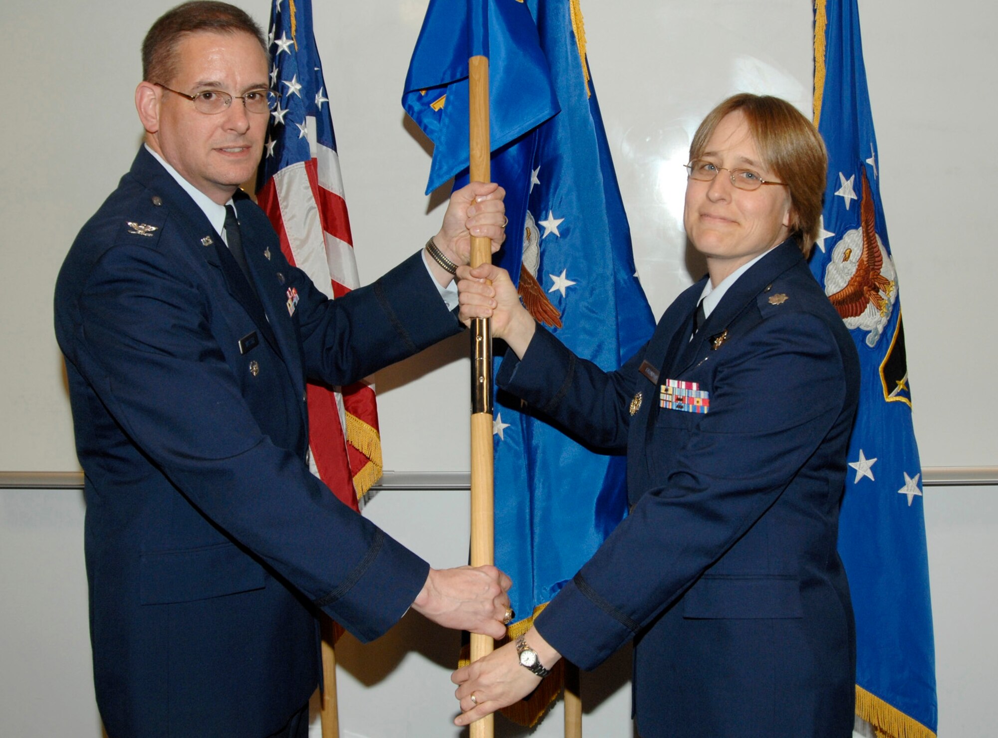 Lt. Col. Janet Grondin assumed command of the new GPS Advanced Control Squadron at the ceremony officiated by Vice Wing Commander Col. Don Wussler.  (Photo by Lou Hernandez)