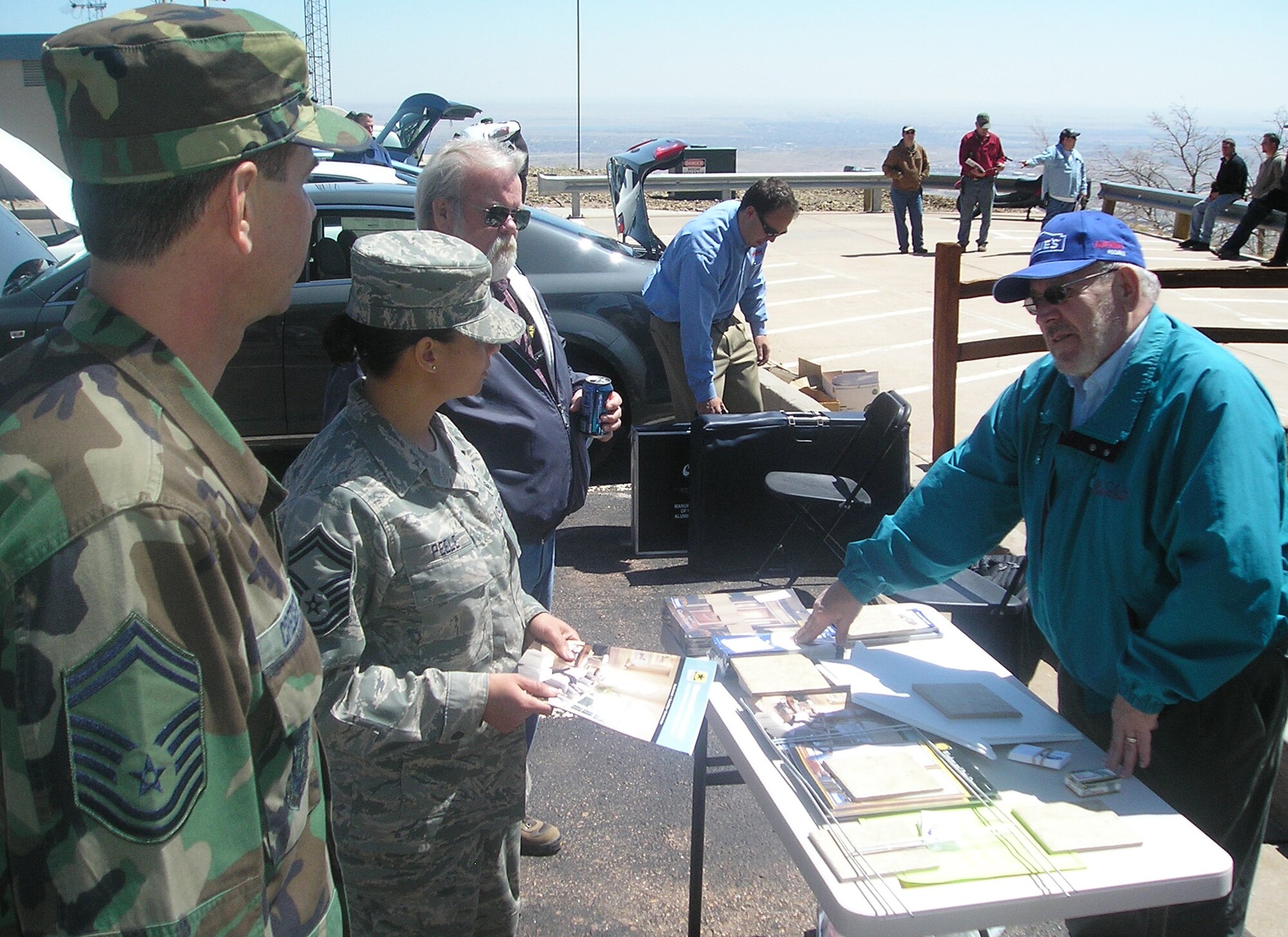 Senior Master Sgts. Idalia Peele and Benjamin Creger learn different ways to make their home more energy efficient from a local Colorado Springs home improvement company representative April 22 at Cheyenne Mountain Air Force Station’s Earth Day event. The event helped to raise awareness of environmental issues and energy conservation techniques through demonstration booths sponsored by local organizations and businesses.  The demonstrations were geared toward what individuals could do personally to conserve on energy. The installation, located in southern Colorado, operates, maintains, secures, sustains, mobilizes, tests and controls the worldwide warning and surveillance system for North America. The Integrated Tactical Warning and Attack Assessment weapon system is airborne, land- and space-based and can sense and report on all activities in air and space. (U.S. Air Force photo/Tech. Sgt. Christopher Campbell)