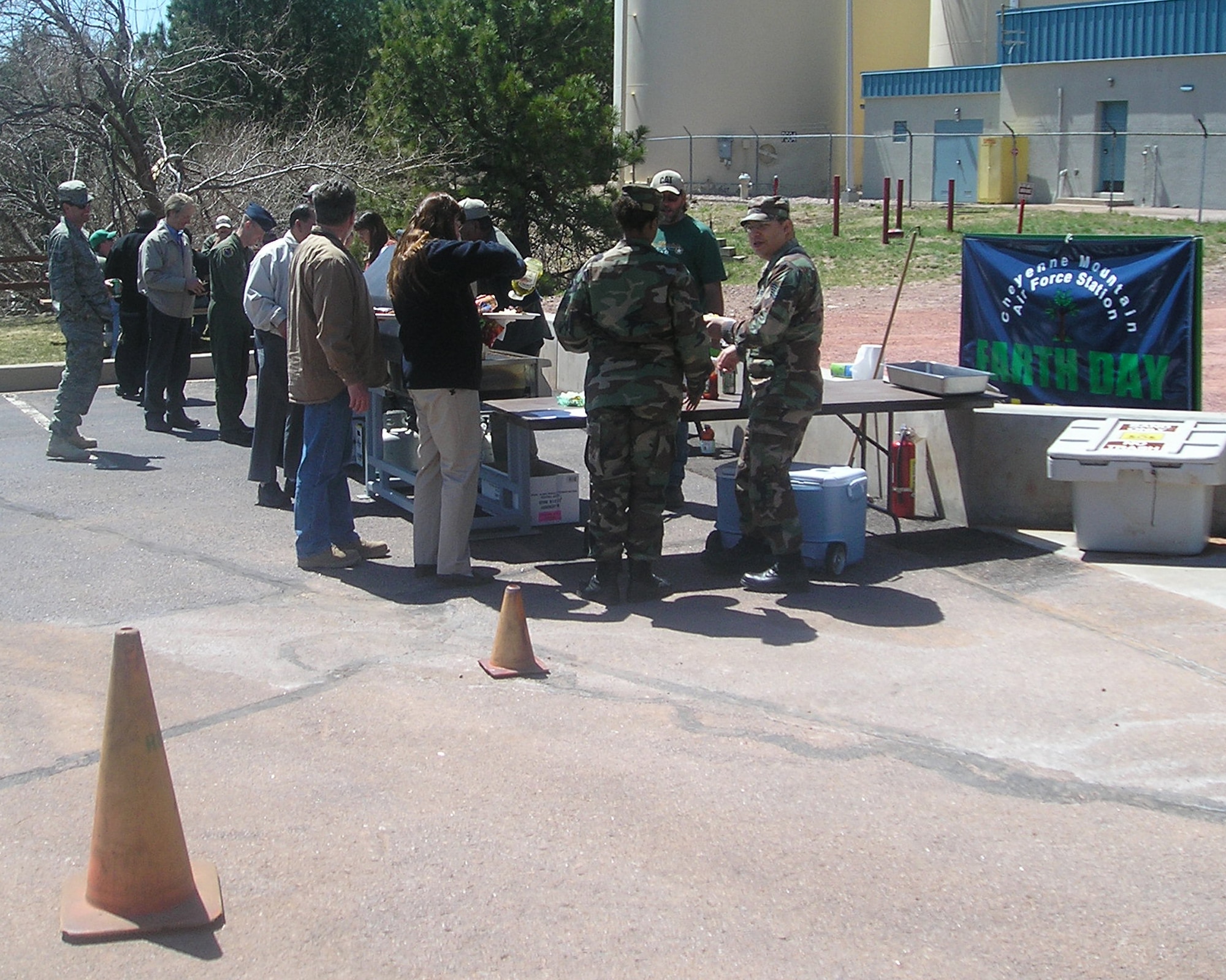 Members of the 721st Civil Engineer Squadron prepare food April 22 for visitors of Cheyenne Mountain Air Force Station’s Earth Day events. The event helped to raise awareness of environmental issues and energy conservation techniques through demonstration booths sponsored by local organizations and businesses.  The demonstrations were geared toward what individuals could do personally to conserve on energy. The installation, located in southern Colorado, operates, maintains, secures, sustains, mobilizes, tests and controls the worldwide warning and surveillance system for North America. The Integrated Tactical Warning and Attack Assessment weapon system is airborne, land- and space-based and can sense and report on all activities in air and space. (U.S. Air Force photo/Tech. Sgt. Christopher Campbell