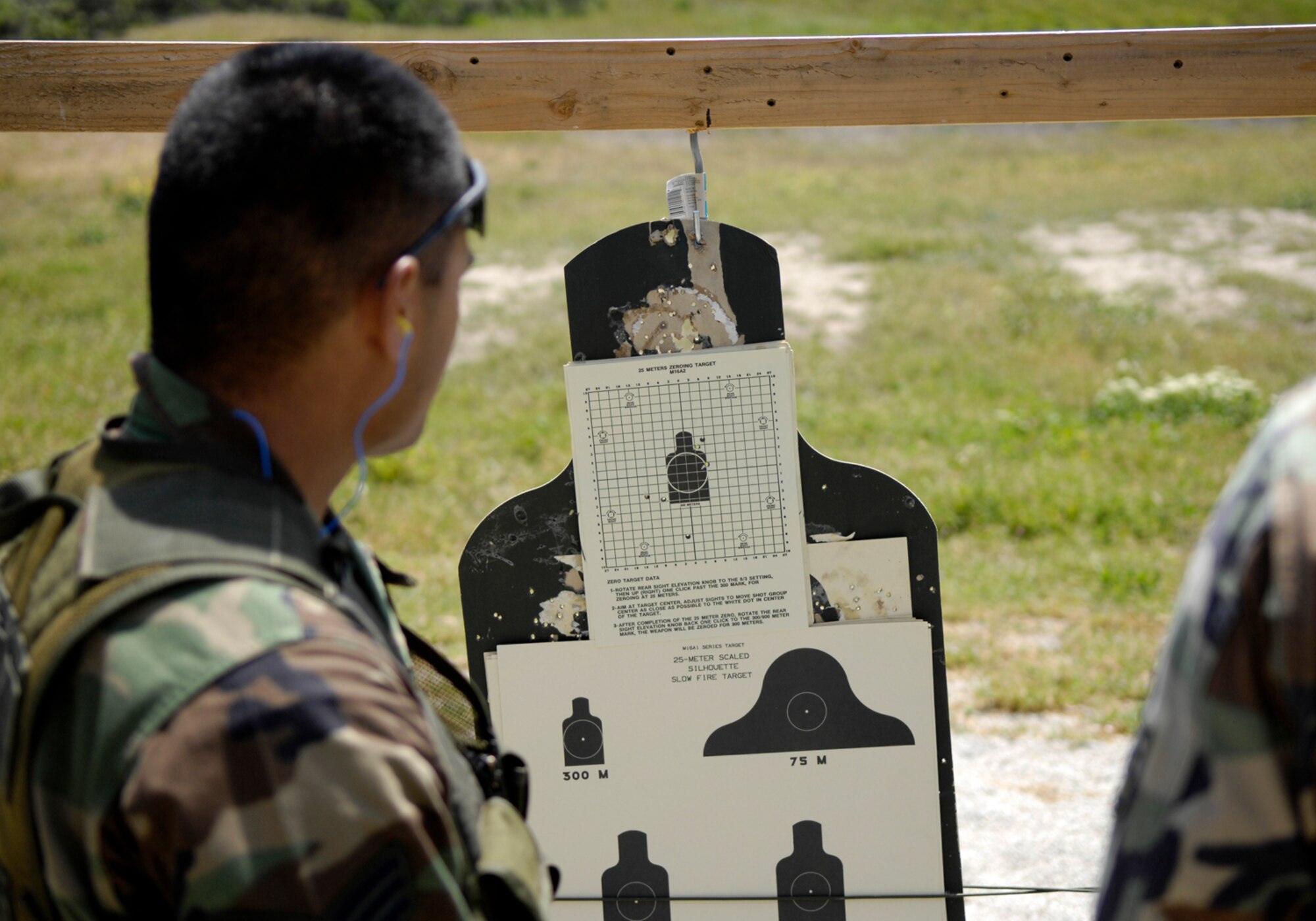 VANDENBERG AIR FORCE BASE, Calif. --  Senior Airman Wilson Yabut, 30th Security Forces Squadron, checks his target during the Firing Range portion of the Guardian Challenge on May 5. (U.S. Air Force photo/Airman 1st Class Jonathan Olds)