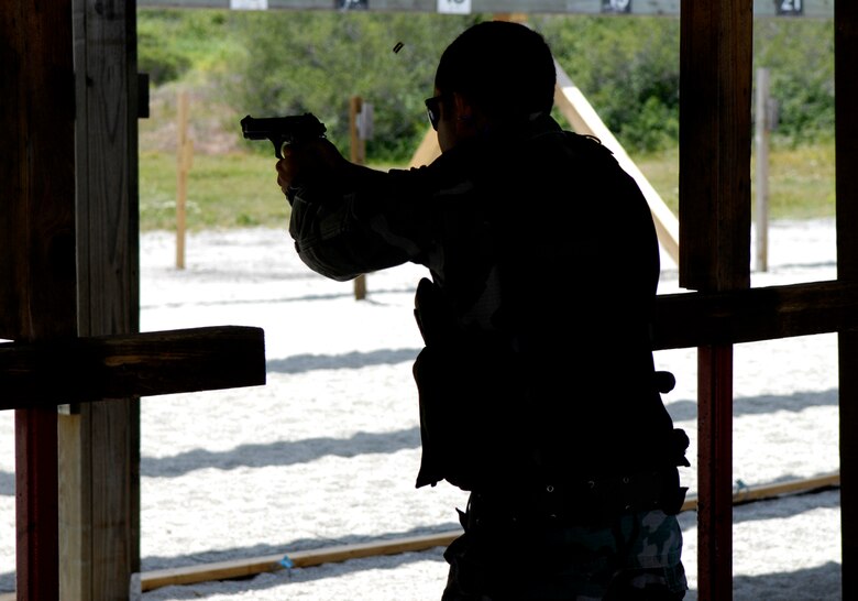VANDENBERG AIR FORCE BASE, Calif. --  Staff Sgt.Tony Perez, 30th Security Forces Squadron, fires his M-9 during the Firing Range portion of the Guardian Challenge on May 5. (U.S. Air Force photo/Airman 1st Class Jonathan Olds)
