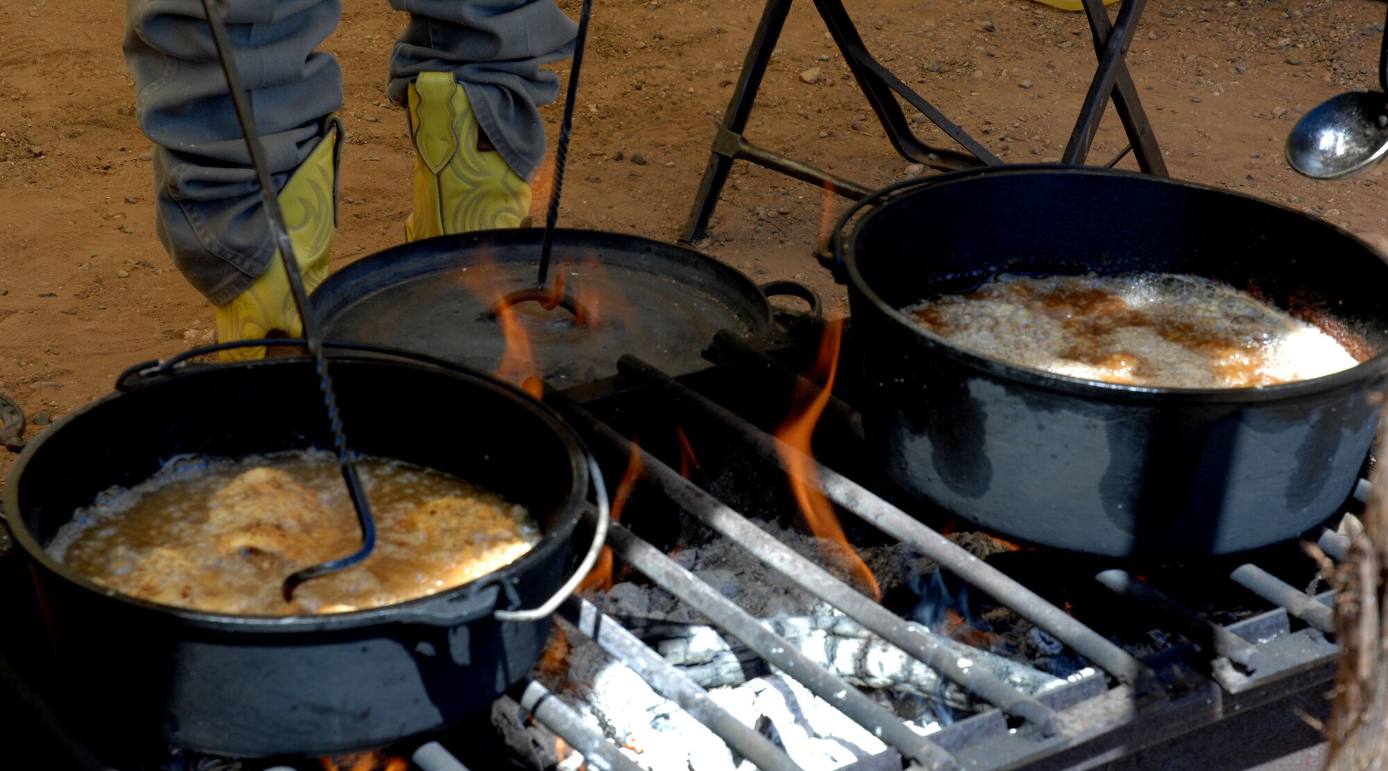 CANNON AIR FORCE BASE, N.M.-- Chicken fried steak cooks in a Dutch oven during the  Clovis Chuck Wagon Cook Off May 3. The Cook Off took place at Curry County Fairgrounds in Clovis, N.M. (U.S. Air Force photo/Airman 1st Class Evelyn Chavez)  