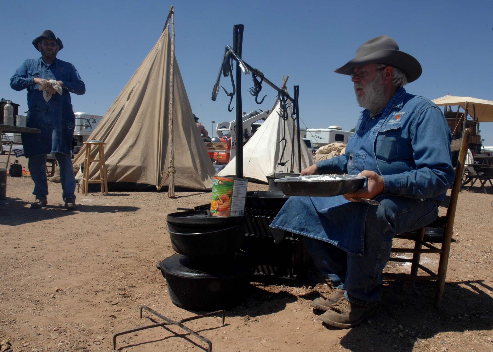 CANNON AIR FORCE BASE, N.M. --  Sam Howell, Odessa,Texas, prepares a peach cobbler for the Clovis Chuck Wagon Cook Off May 3. The Cook Off took place at Curry County Fairgrounds in Clovis, N.M. (U.S. Air Force photo/Airman 1st Class Evelyn Chavez)  