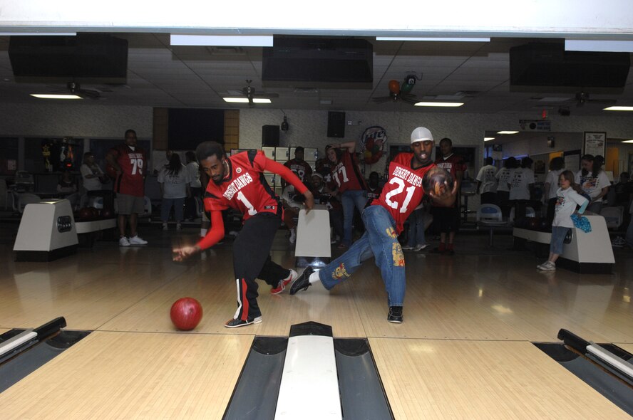 (Left to Right) Donte' Minger and Airman 1st Class Andre Powell bowls during Bowl For Kid's Sake, presented by Big Brothers Big Sisters of Otero County April 14, 2008 at Holloman Air Force Base, N.M. Both are members of the Semi-pro football team Alamogordo Desert Dawgs, volunteers for Big Brother's Big Sisters, and served or currently serving as an active duty Air Force member. (U.S. Air Force photo/ Senior Airman Anthony Nelson Jr)