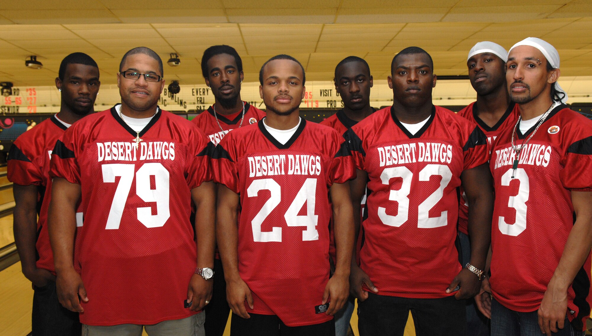 Members of the semi-pro football team Alamogordo Desert Dawgs take a group photo during Bowl For Kid's Sake, presented by Big Brothers Big Sisters of Otero County April 14, 2008 at Holloman Air Force Base, N.M. These football players are members of the Semi-pro football team Alamogordo Desert Dawgs, volunteers for Big Brother's Big Sisters, prior active duty Air Force, Air Force dependents, and an active duty Air Force members. (U.S. Air Force photo/ Senior Airman Anthony Nelson Jr)