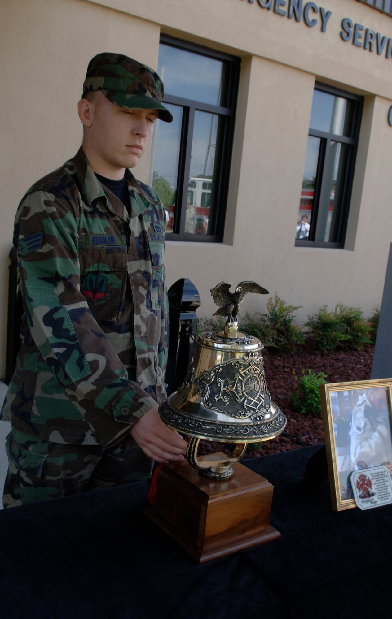 MOODY AIR FORCE BASE, Ga – Senior Airman Travis Kessler, 23rd Civil Engineer Squadron firefighter, rings a bell in memory of Senior Airman Jay Klatt here May 5. Airman Klatt passed away May 1 after a battle with cancer. (U.S. Air Force photo by Senior Airman Schelli Jones)
