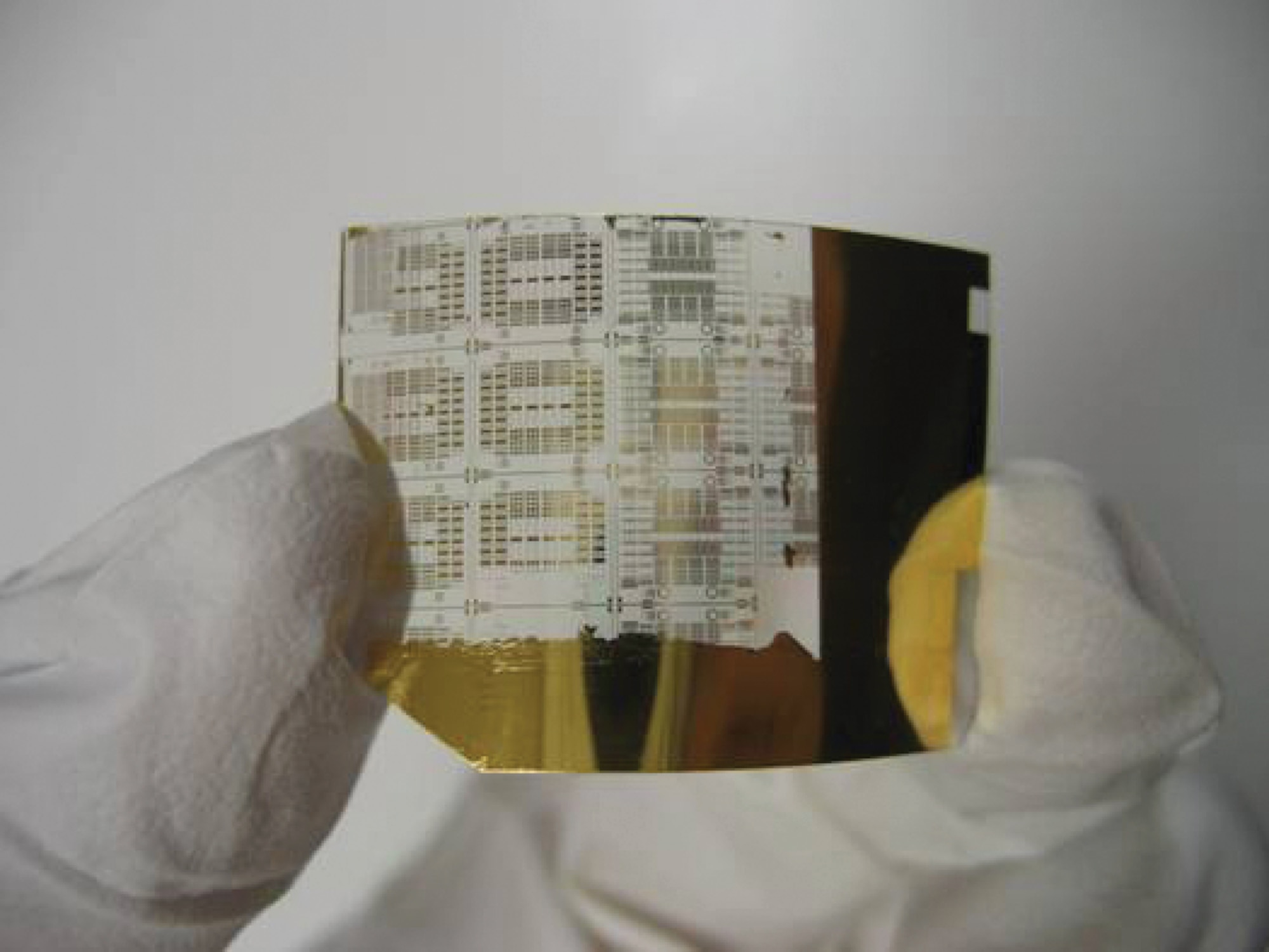 The flexibility of superthin silicon transistors (pictured) could lead to electronics attached to unevenly shaped objects such as airplane bodies or engines (image courtesy of Dr. Jack Ma, University of Wisconsin-Madison).