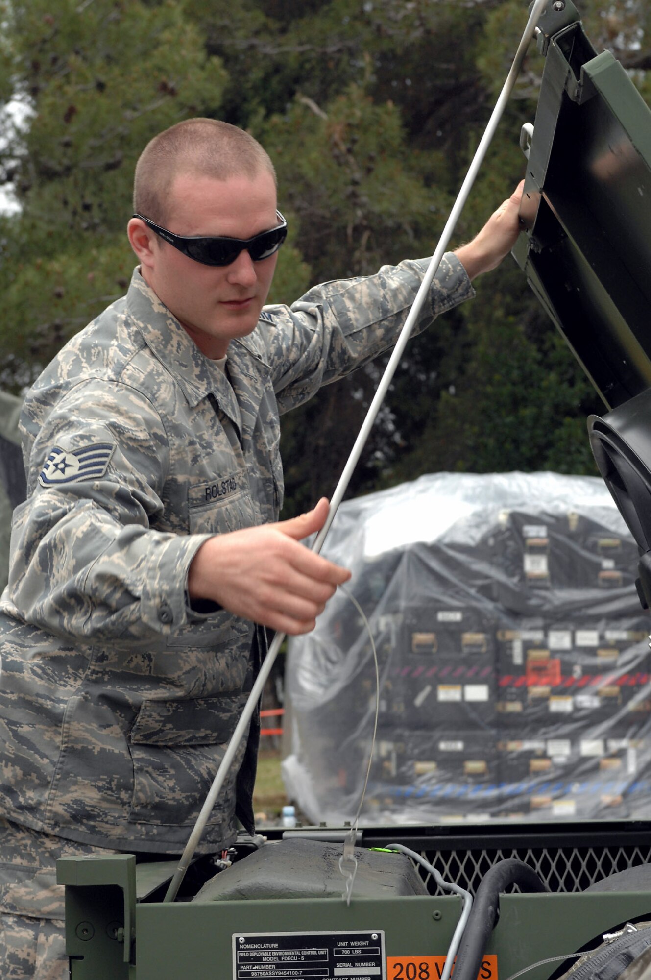 Staff Sgt. Travis Rolstad ensures an air-conditioning unit is working properly for Medical Central and Eastern Europe Exercise 2008 April 29 at Divulje Training Base, Croatia. Seventeen nations are participating in the exercise May 2 through 15. The exercise focuses on mass-casualty training scenarios and humanitarian aid in response to crises situations. More than 400 multinationals are attending the exercise in support of the Partnership for Peace initiative. Sergeant Rolstad is assigned to the 1st Combat Communications Squadron from Ramstein Air Base, Germany. (U.S. Air Force photo/Staff Sgt. Kristin Ruleau) 
