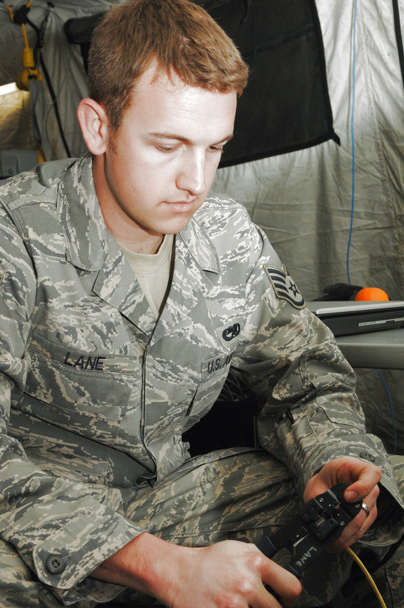 Staff Sgt. William Lane terminates a cable during the Medical Central and Eastern Europe Exercise 2008 April 29 at Divulje Training Base, Croatia. Seventeen nations are participating in the exercise May 2 through 15. The exercise focuses on mass-casualty training scenarios and humanitarian aid in response to crises situations. More than 400 multinationals are attending the exercise in support of the Partnership for Peace initiative. Sergeant Lane is assigned to the 1st Combat Communications Squadron from Ramstein Air Base, Germany. (U.S. Air Force photo/Staff Sgt. Kristin Ruleau) 
