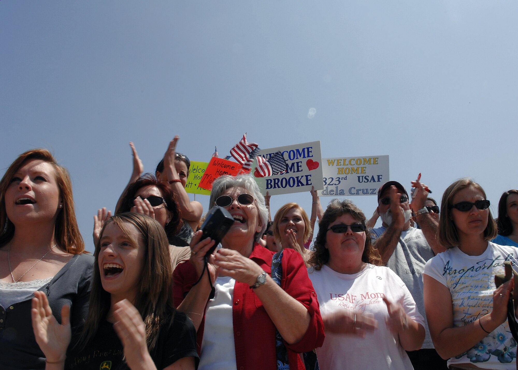 Family members, friends and co-workers cheer as Airmen of the 823rd Security Forces Squadron return from a six-month deployment April 29 at Moody Air Force Base, Ga. Members of the 823rd SFS returned from a six-month deployment to Camp Bucca, Iraq. All of the unit's Airmen and military working dogs returned home safely. (U.S. Air Force photo/Airman 1st Class Brittany Barker) 

