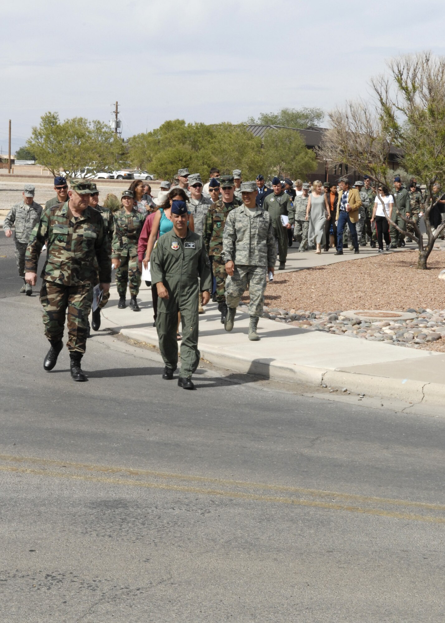 A remembrance walk is held from the Desert Sands Club to the base chapel here April 29. (U.S. Air Force photo/Airman 1st Class Rachel A. Kocin)
