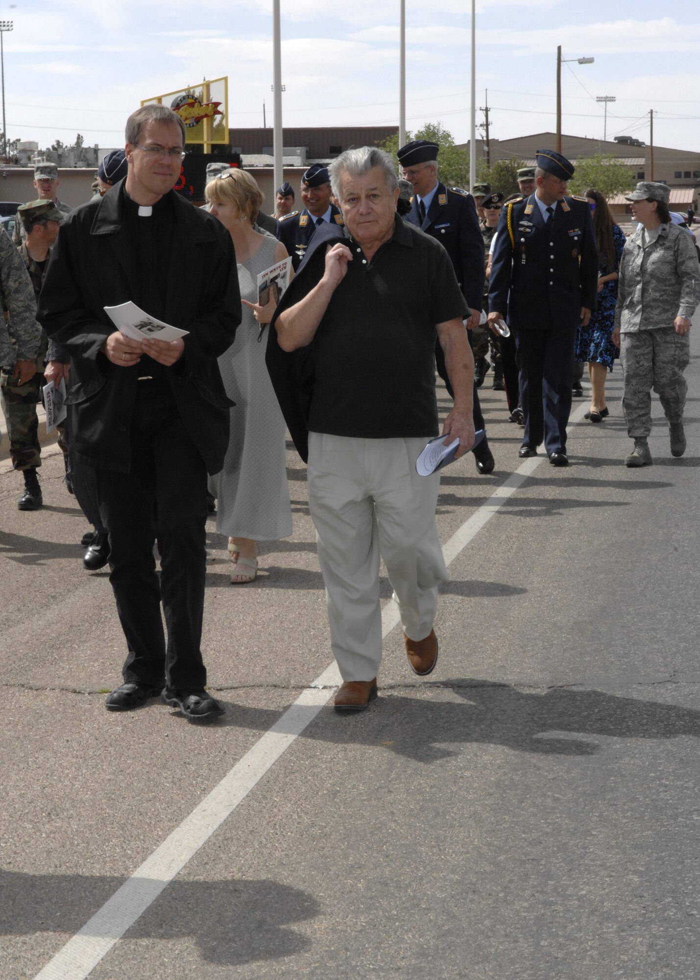 Mr. Theodore Lehman, Holocaust survivor, walks in the remembrance walk from the Desert Sands Club to the base chapel, here April 29. (U.S. Air Force photo/Airman 1st Class Rachel A. Kocin)