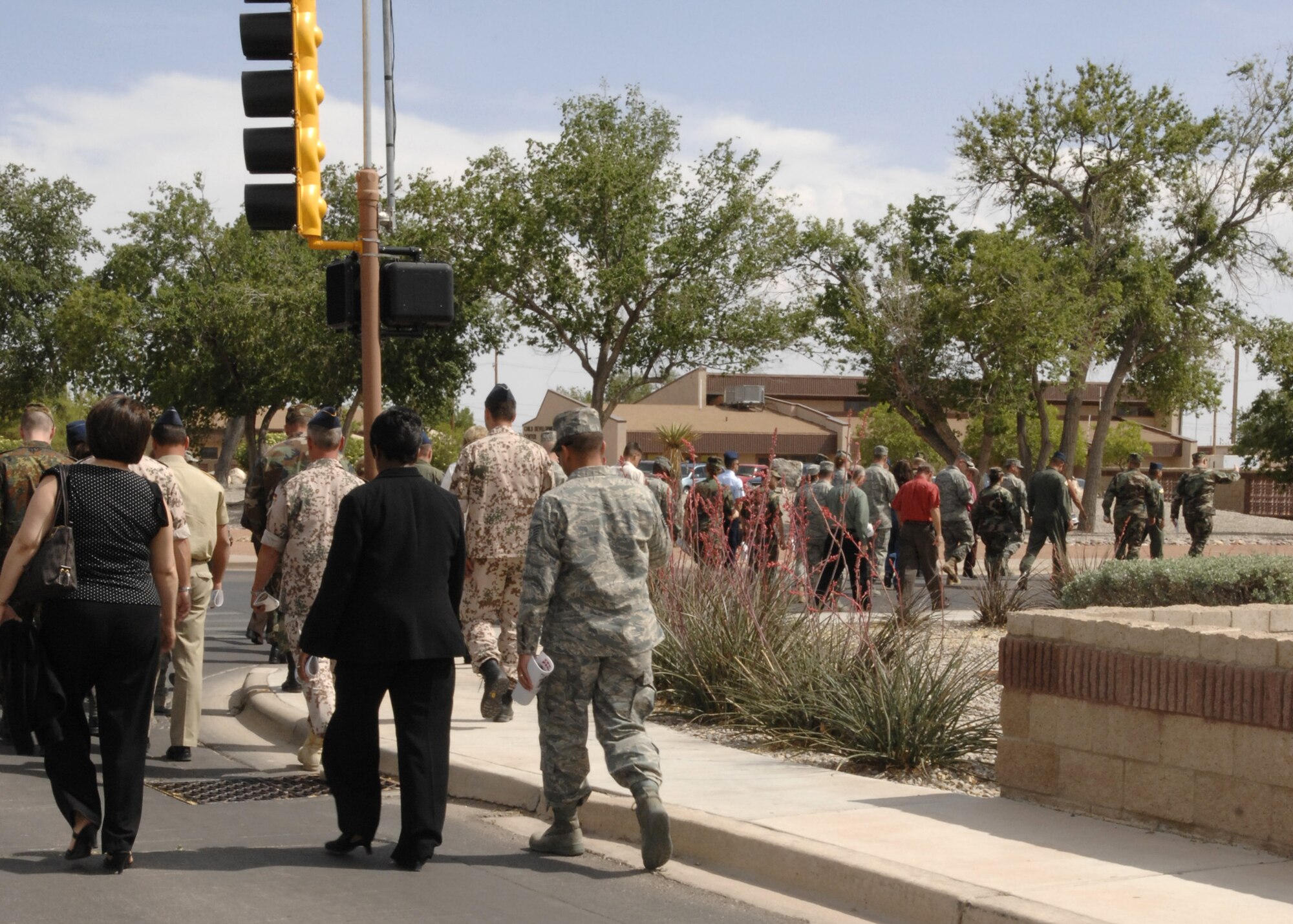 A remembrance walk is held from the Desert Sands Club to the base chapel here April 29. This walk was held as part of the Holocaust Remembrance Ceremony. (U.S. Air Force photo/Airman 1st Class Rachel A. Kocin)