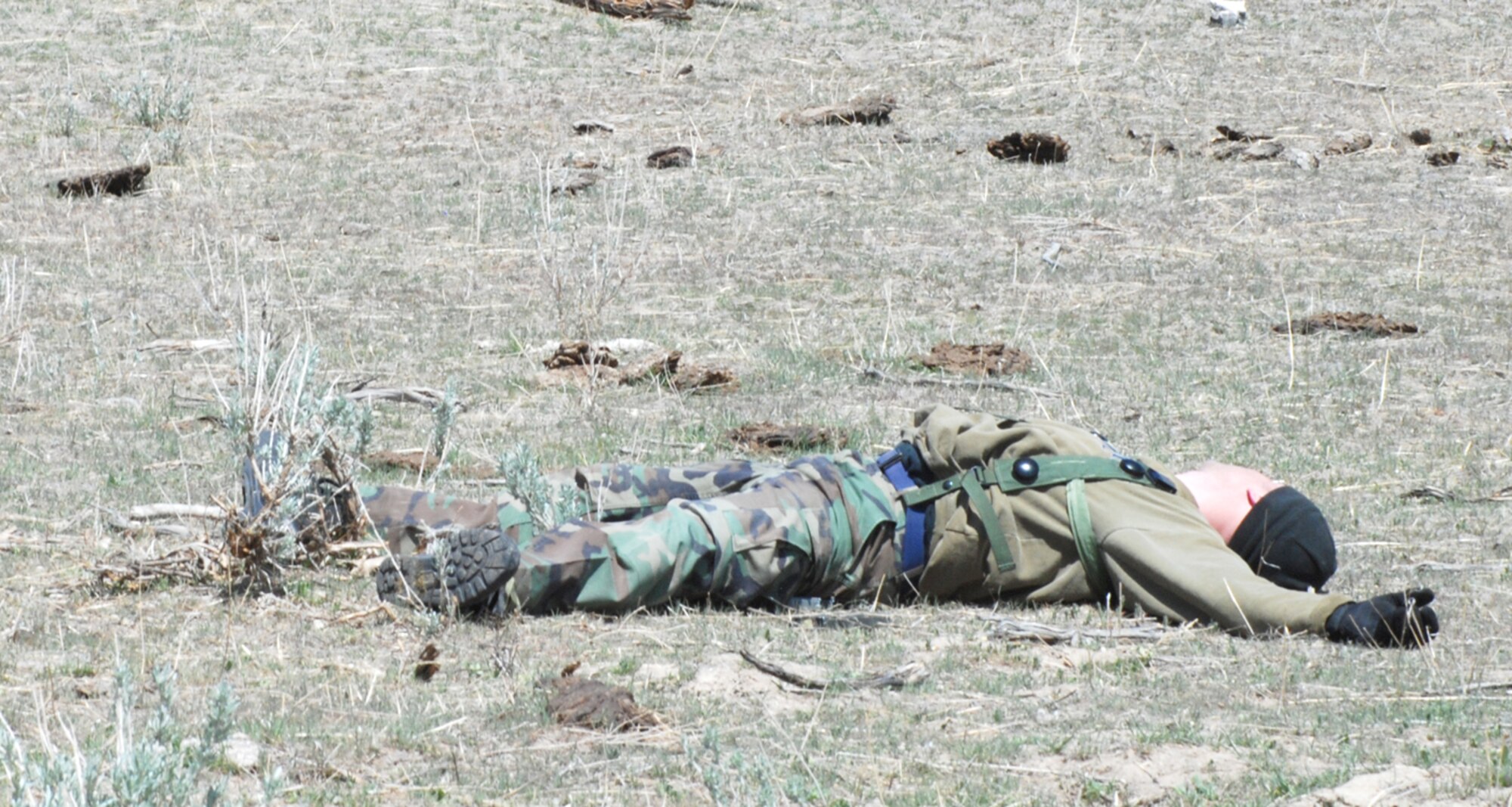 An oposing forces member plays dead until this portion of the event ended. The OPFOR challenged the security forces members while they tried to secure the classified material.