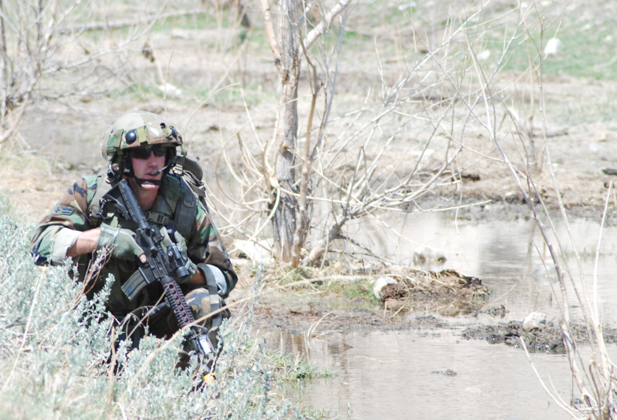 Airman 1st Class Daniel Reaume, 90th Security Forces Group Tactical Response Force, provides cover for a fellow Airman to move forward and secure the classified material.