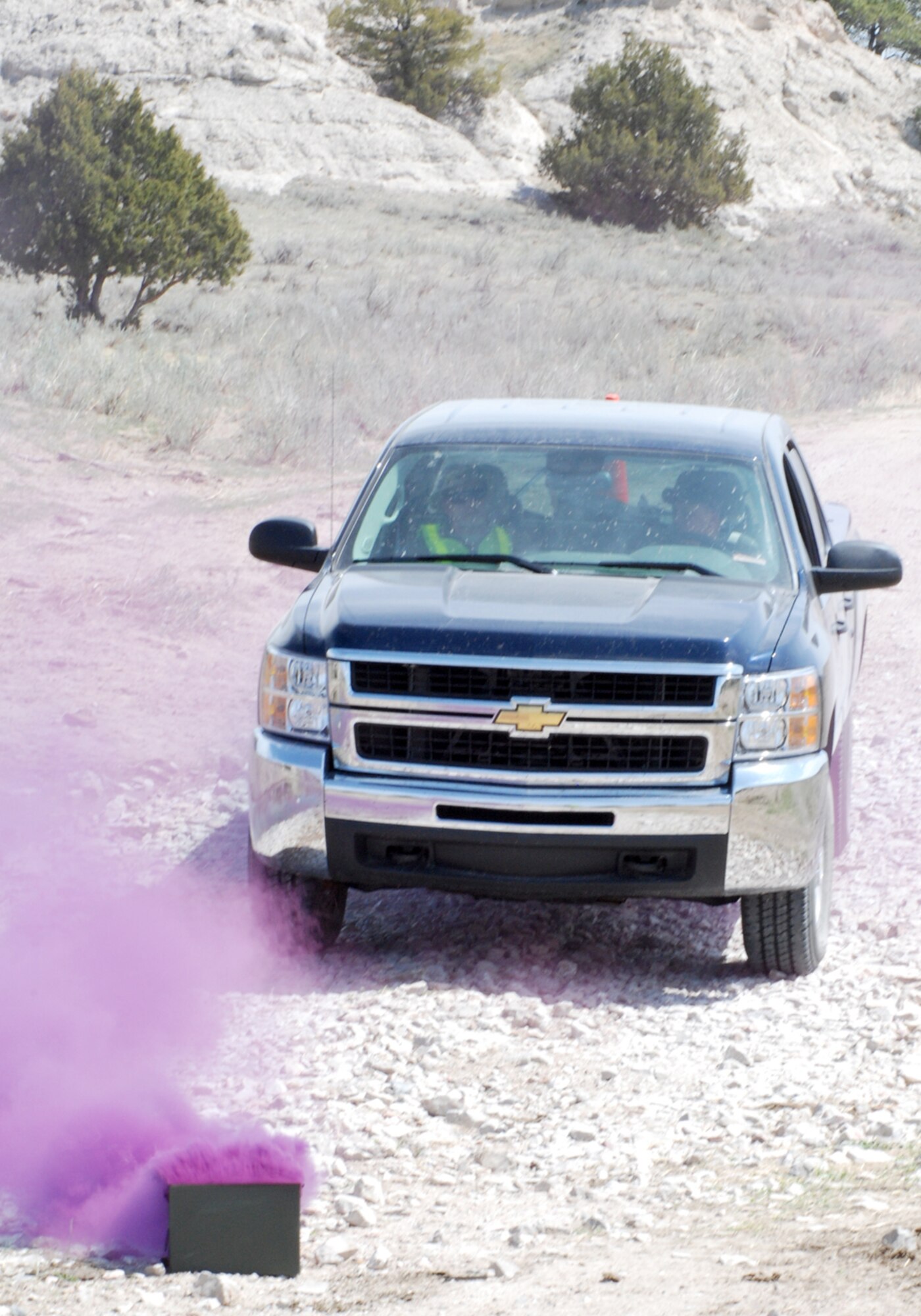 The OPFOR simulate an attack and disable a truck carrying classified material during the Guardian Challenge event. The smoke acted as a signal for the security forces and 37th HS to pinpoint the location of the vehicle.