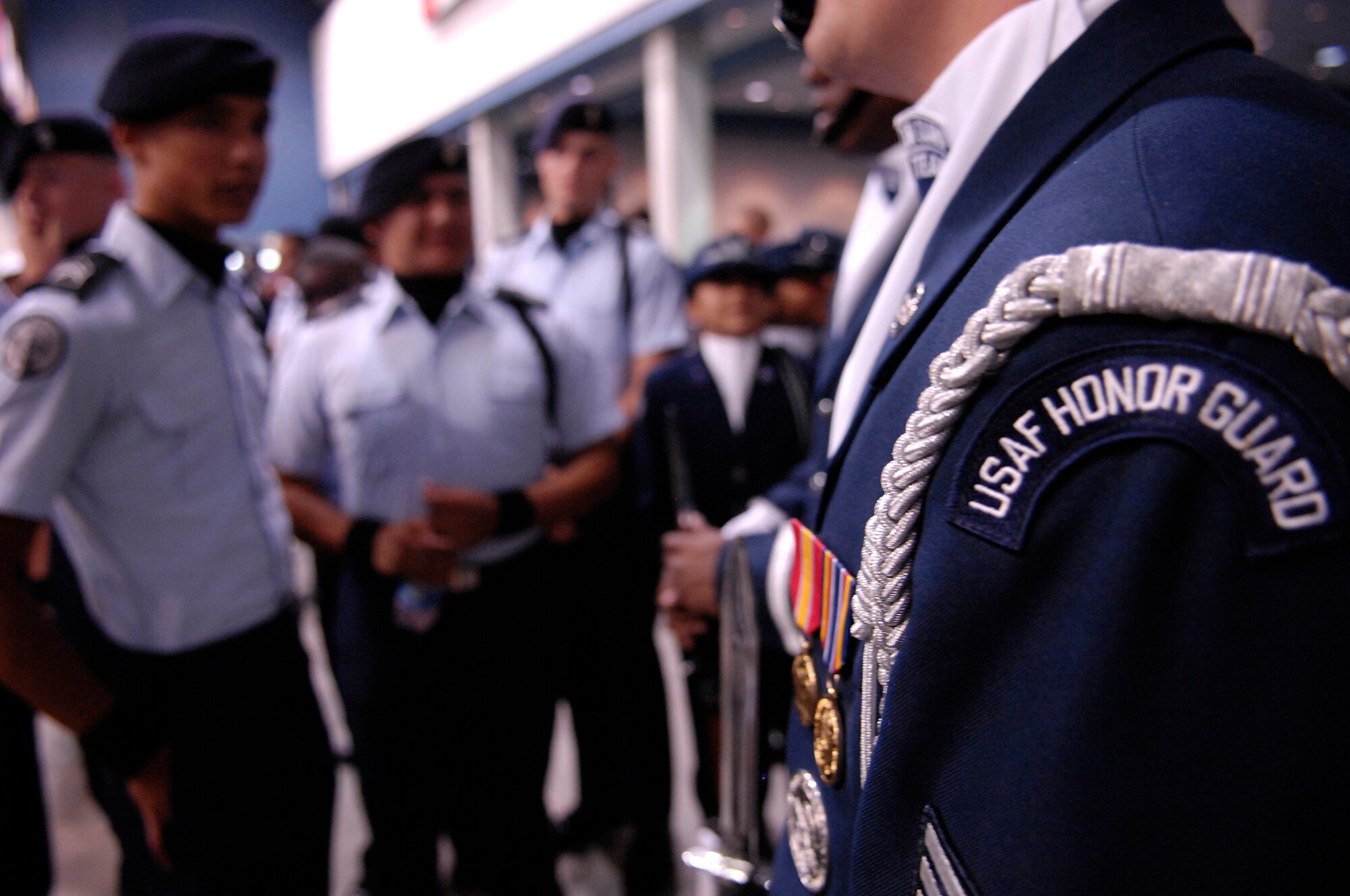 JROTC cadets surround members of the Air Force Honor Guard Drill Team after their performance at the National High School Drill Team Competition in Daytona Beach, Fla. 4 May. The Drill Team is the traveling component of the Air Force Honor Guard and tours world-wide representing all Airmen and showcasing USAF precision to recruit, retain, and inspire for the Air Force mission. (U.S. Air Force photo by Senior Airman Dan DeCook)(Released)